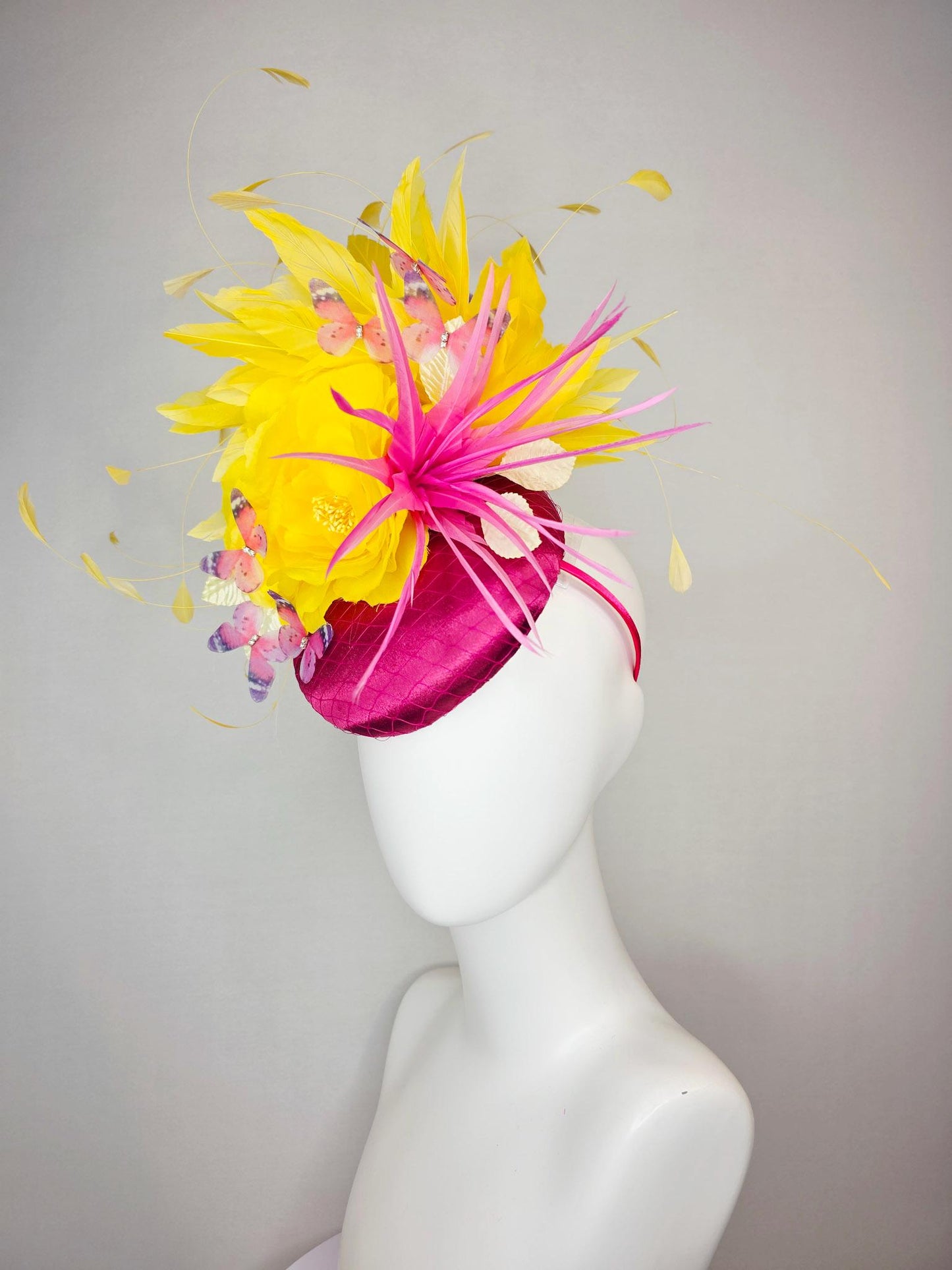 kentucky derby hat fascinator hot pink satin with netting yellow satin rose white leaves pink feather flower yellow feathers and butterflies
