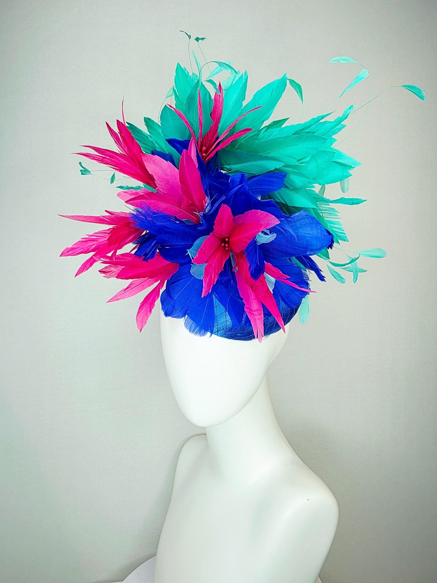 kentucky derby hat fascinator cobalt royal blue satin with netting pink feather flowers cobalt blue and mint aqua green branching feathers