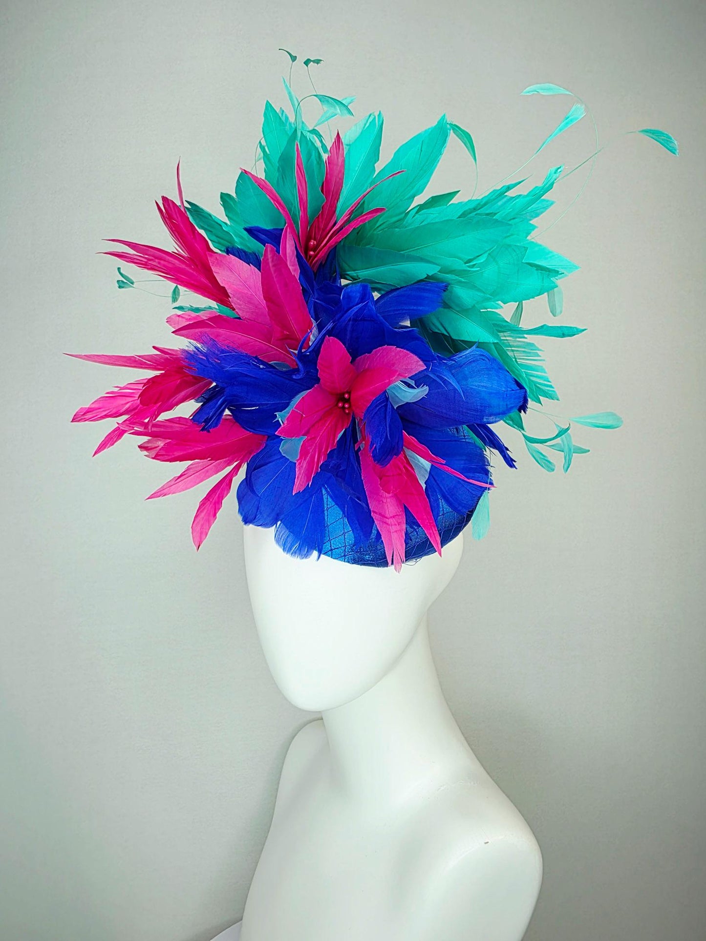 kentucky derby hat fascinator cobalt royal blue satin with netting pink feather flowers cobalt blue and mint aqua green branching feathers