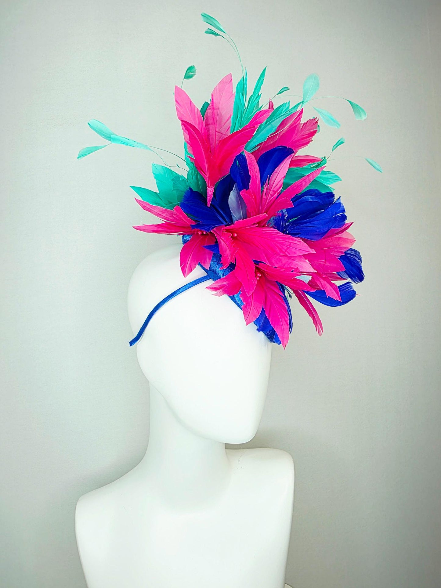 kentucky derby hat fascinator cobalt royal blue satin with netting pink feather flowers cobalt blue and mint aqua green branching feathers