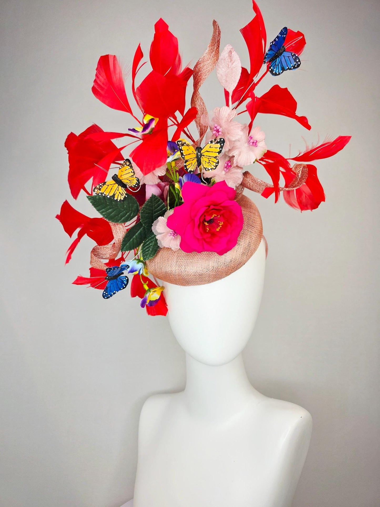 kentucky derby hat fascinator champagne pink sinamay fuchsia satin rose light pink flowers green leaves red feathers blue yellow butterflies