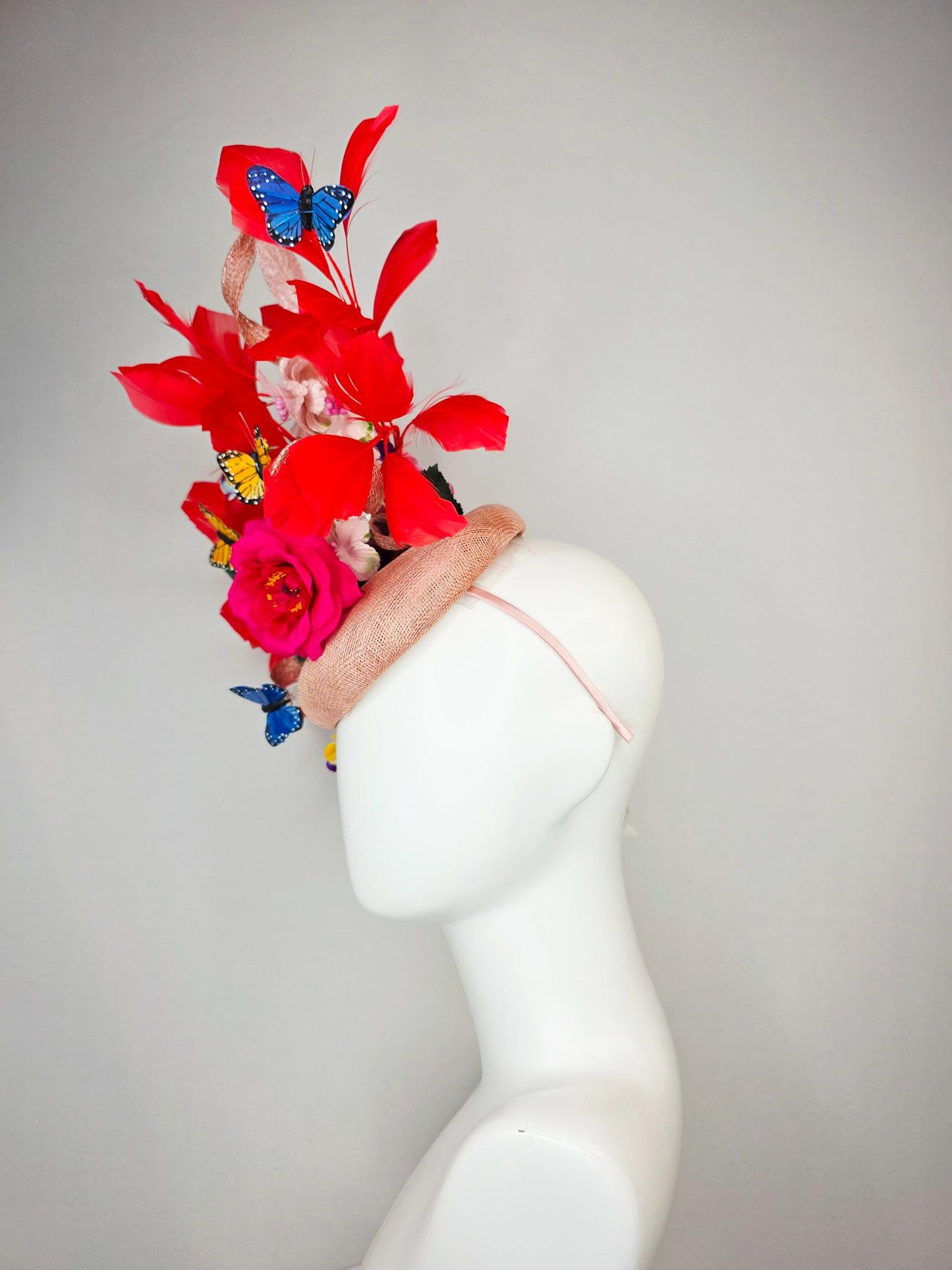 kentucky derby hat fascinator champagne pink sinamay fuchsia satin rose light pink flowers green leaves red feathers blue yellow butterflies
