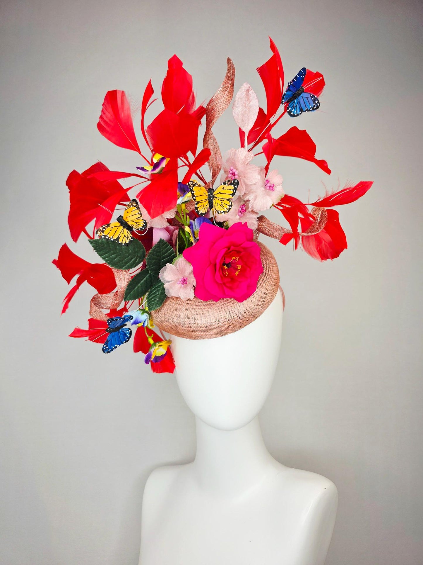 kentucky derby hat fascinator champagne pink sinamay fuchsia satin rose light pink flowers green leaves red feathers blue yellow butterflies