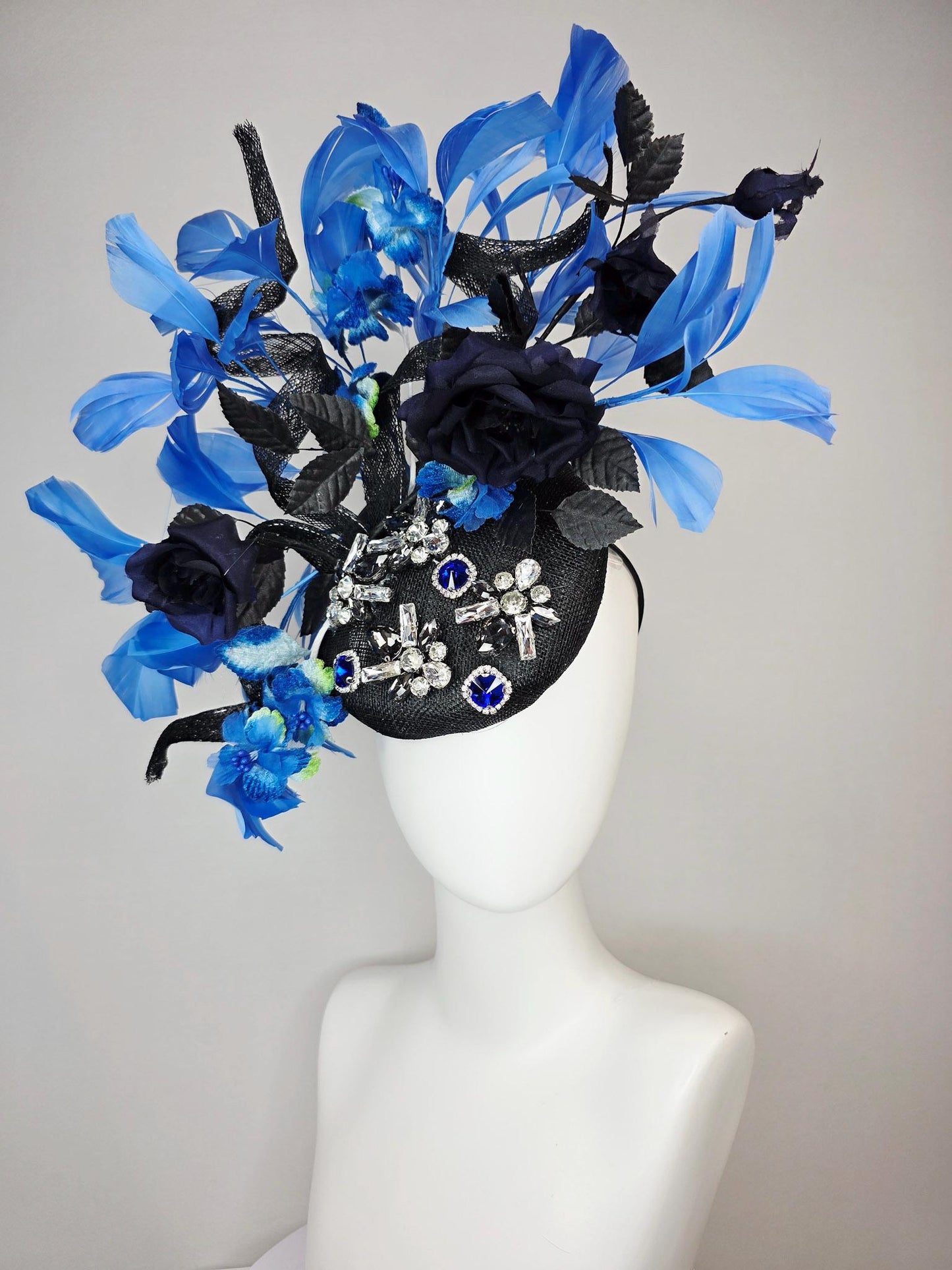 kentucky derby hat fascinator black sinamay with curls blue and clear crystal jewels navy blue satin roses black leaves royal blue feathers