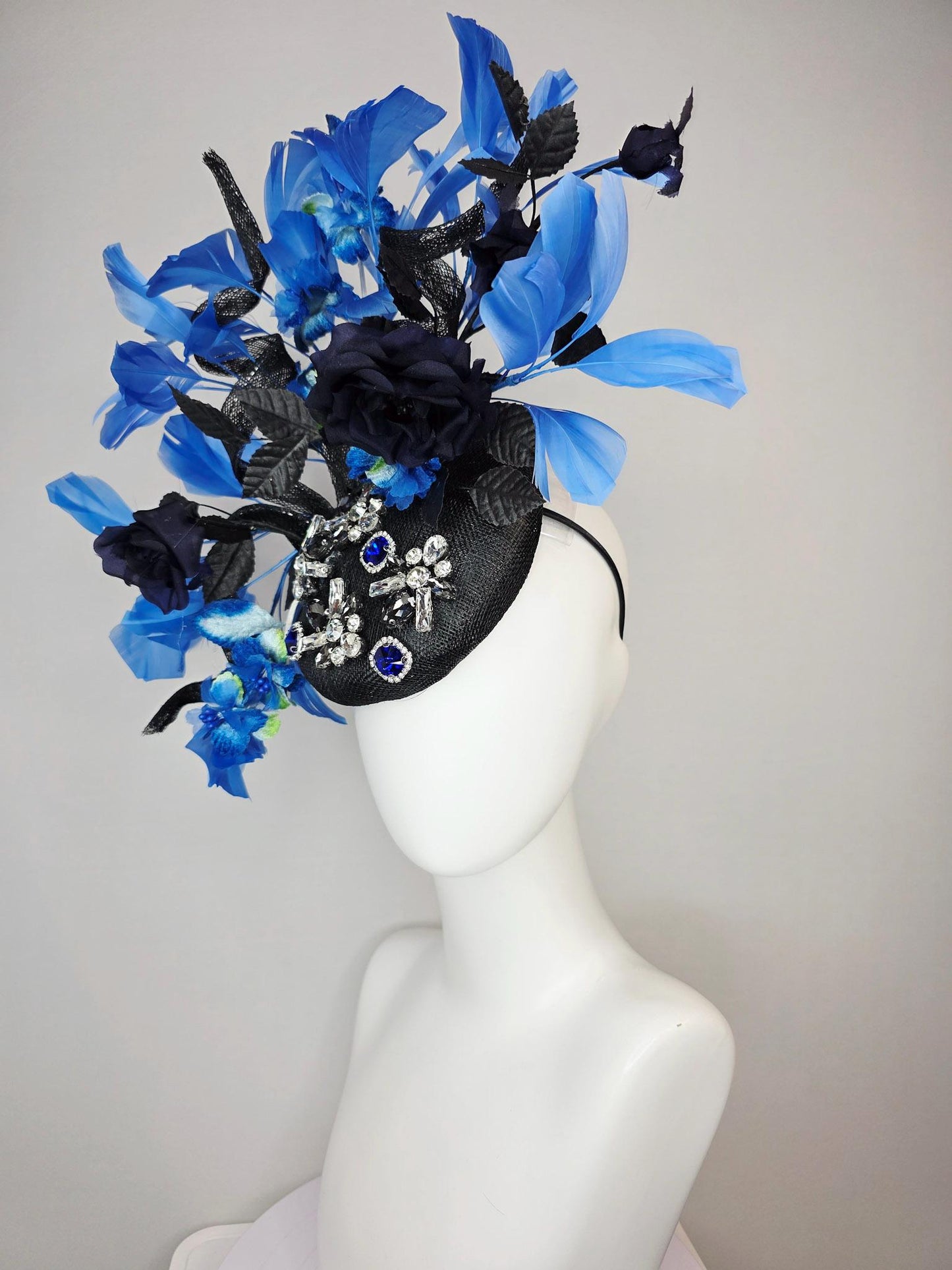 kentucky derby hat fascinator black sinamay with curls blue and clear crystal jewels navy blue satin roses black leaves royal blue feathers