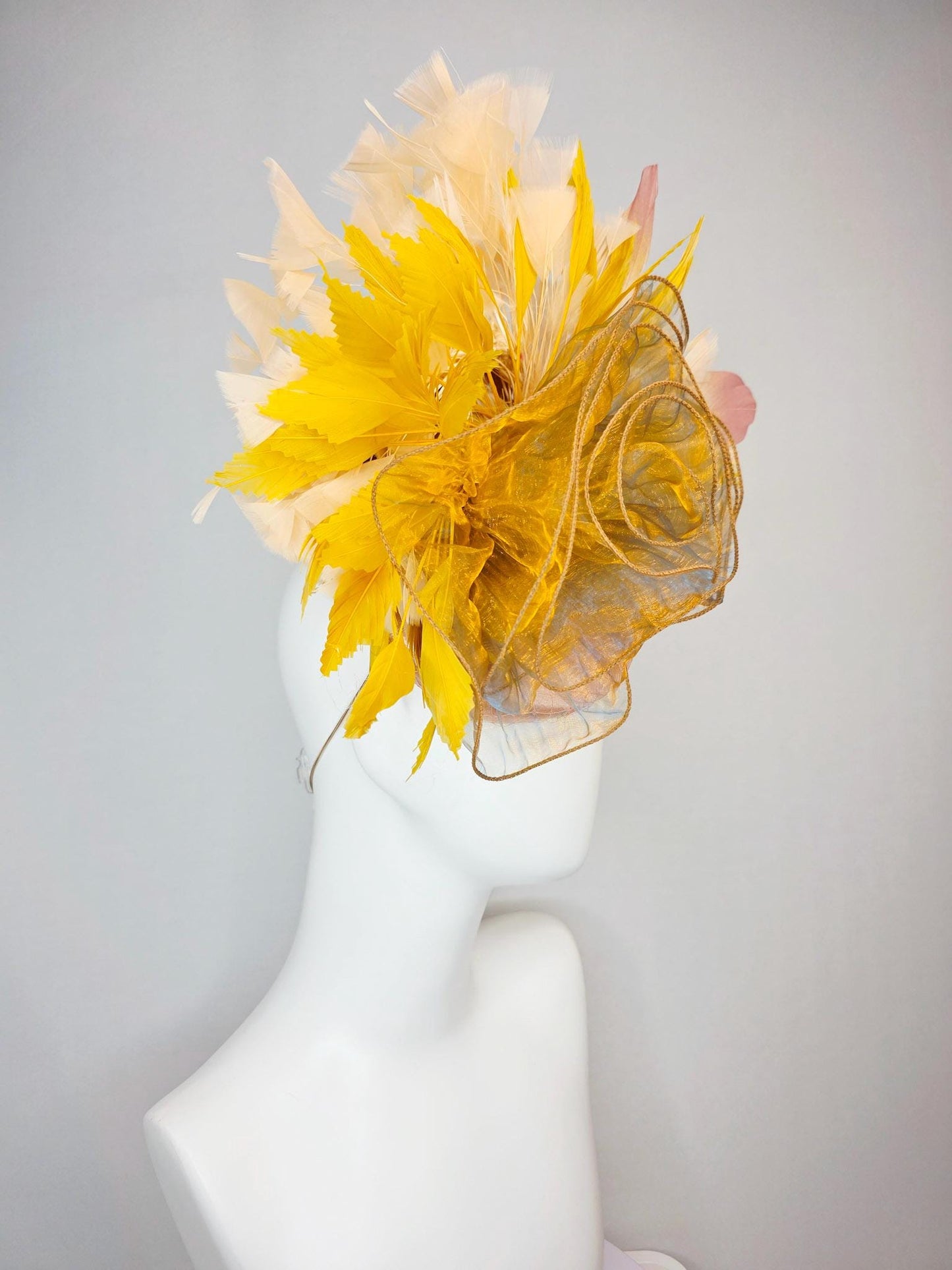 kentucky derby hat fascinator champagne pink satin with netting with large gold organza flower and mustard yellow cream beige feathers