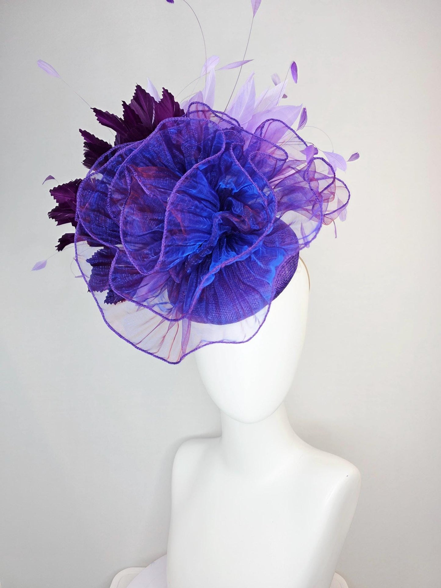 kentucky derby hat fascinator purple sinamay with large purple blue organza flower lavender and violet purple branching feathers