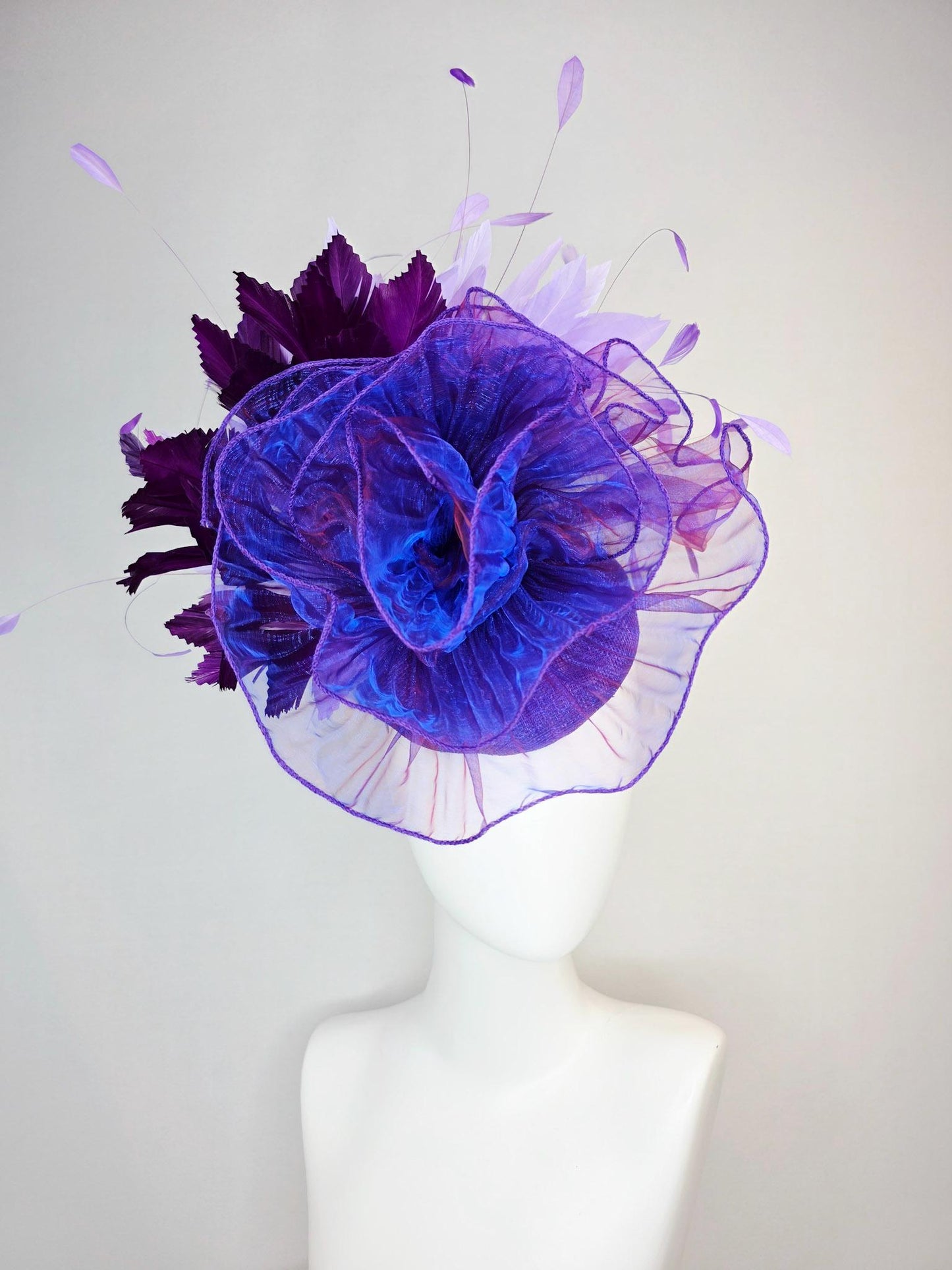kentucky derby hat fascinator purple sinamay with large purple blue organza flower lavender and violet purple branching feathers