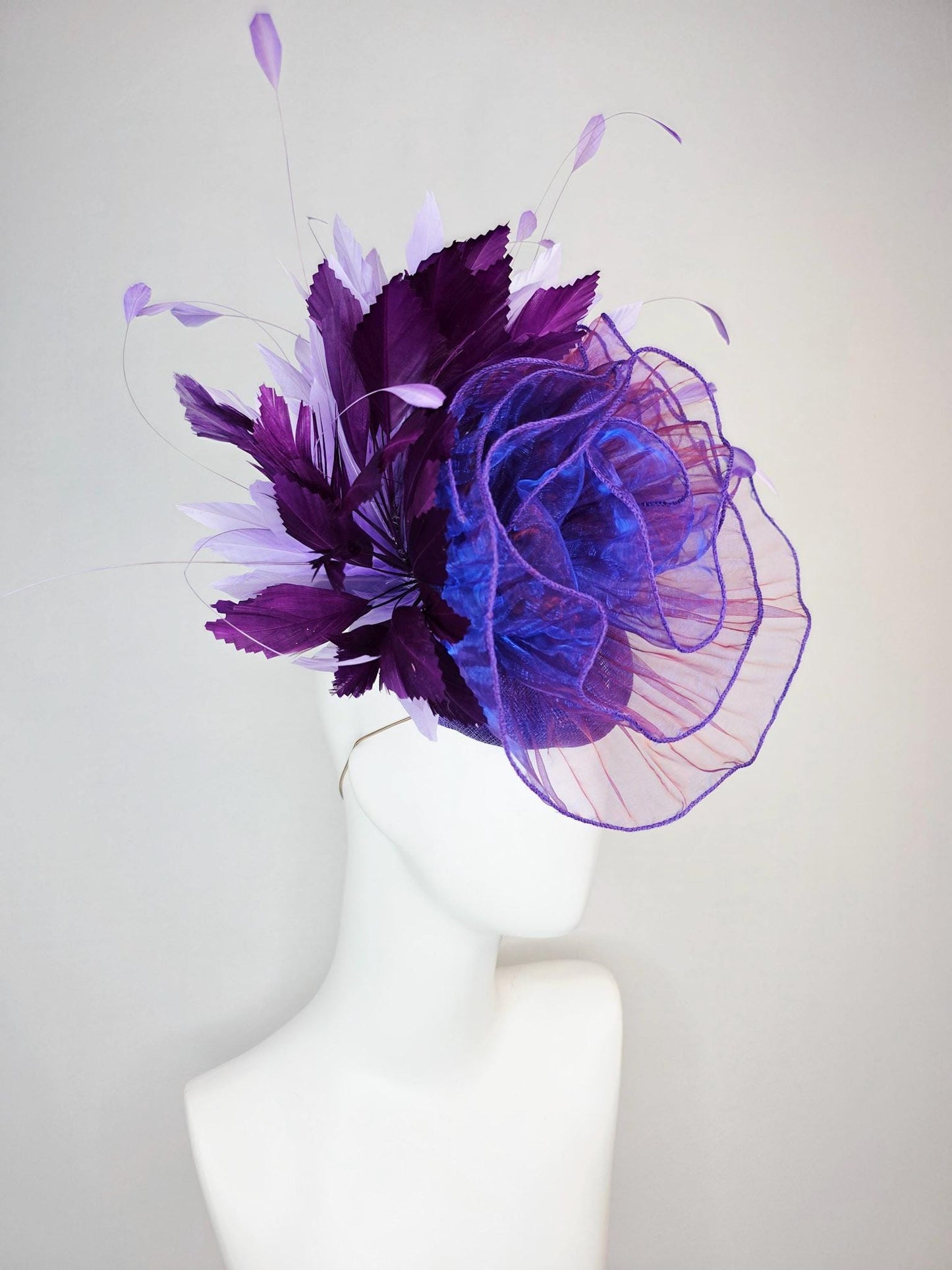 kentucky derby hat fascinator purple sinamay with large purple blue organza flower lavender and violet purple branching feathers