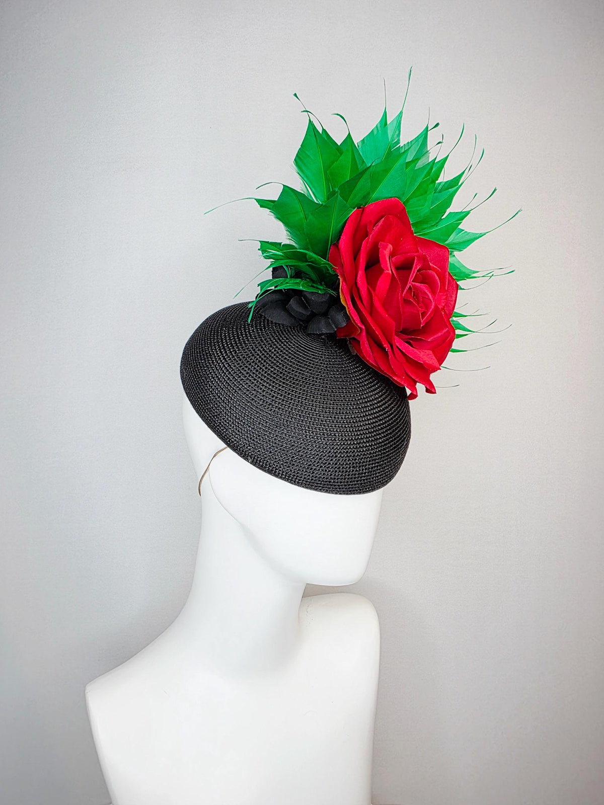 kentucky derby hat fascinator black straw base with large cherry red satin rose and bright green branching feathers