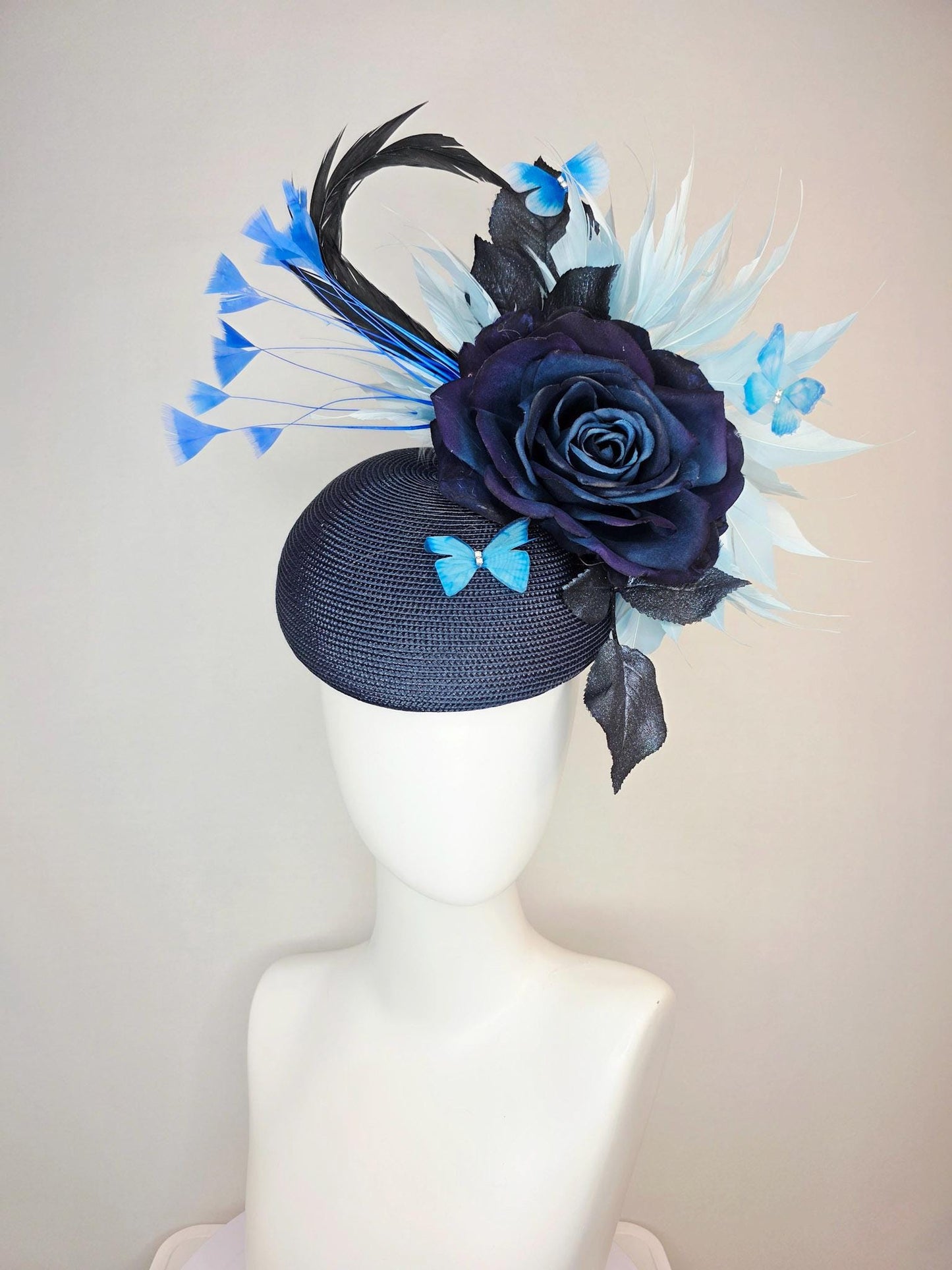 kentucky derby hat fascinator navy blue straw base large navy blue silk rose black leaves sky and baby blue feathers blue butterflies