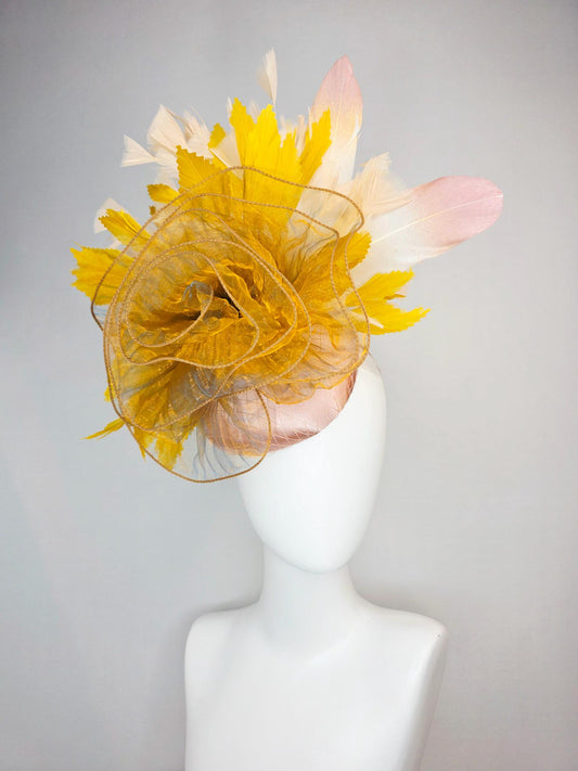 kentucky derby hat fascinator champagne pink satin with netting with large gold organza flower and mustard yellow cream beige feathers