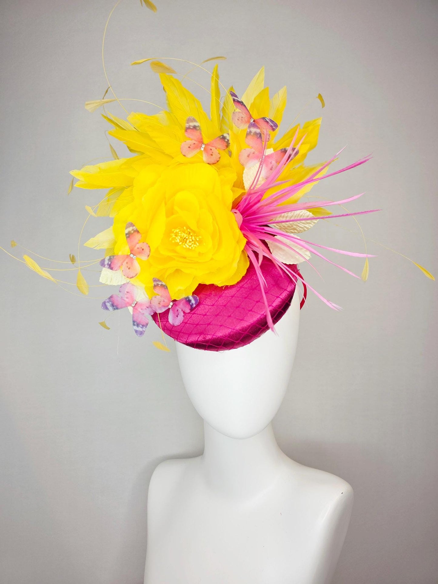 kentucky derby hat fascinator hot pink satin with netting yellow satin rose white leaves pink feather flower yellow feathers and butterflies
