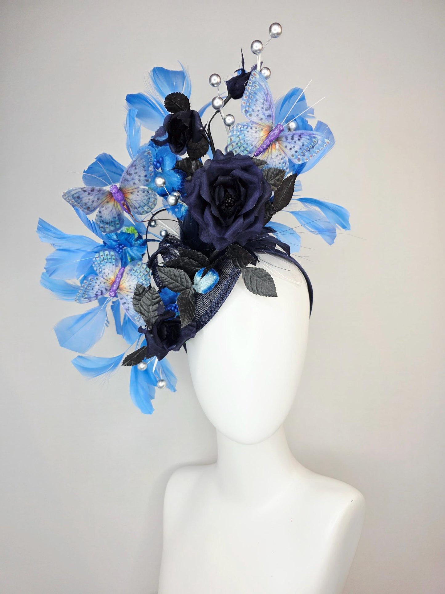 kentucky derby hat fascinator navy blue satin roses black leaves royal blue sky blue feathers silver pearls lavender purple blue butterflies