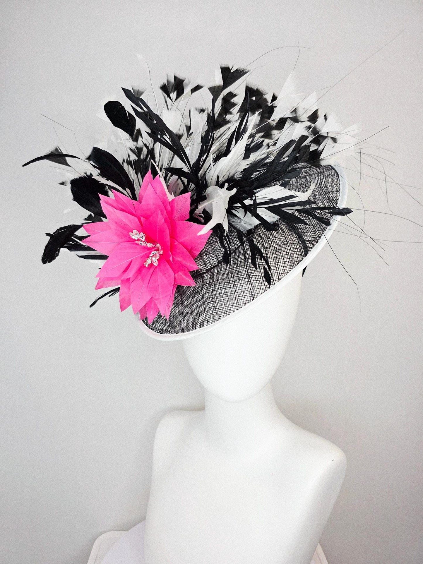 kentucky derby hat fascinator black and white sinamay saucer with white sinamay trim pink feather flower black and white branching feathers