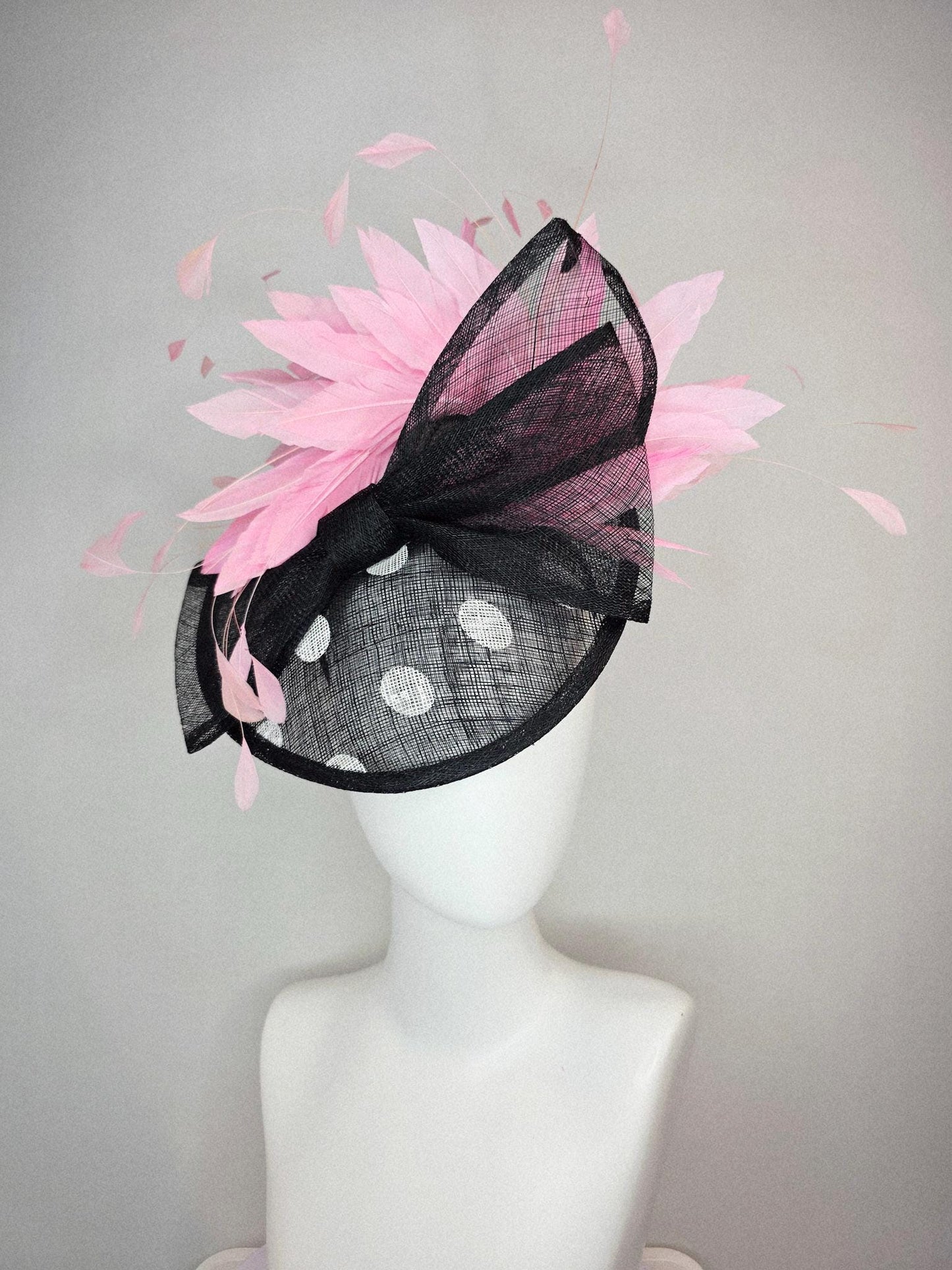 kentucky derby hat fascinator black and white polka dot sinamay saucer with black sinamay bow and light baby pink branching feathers