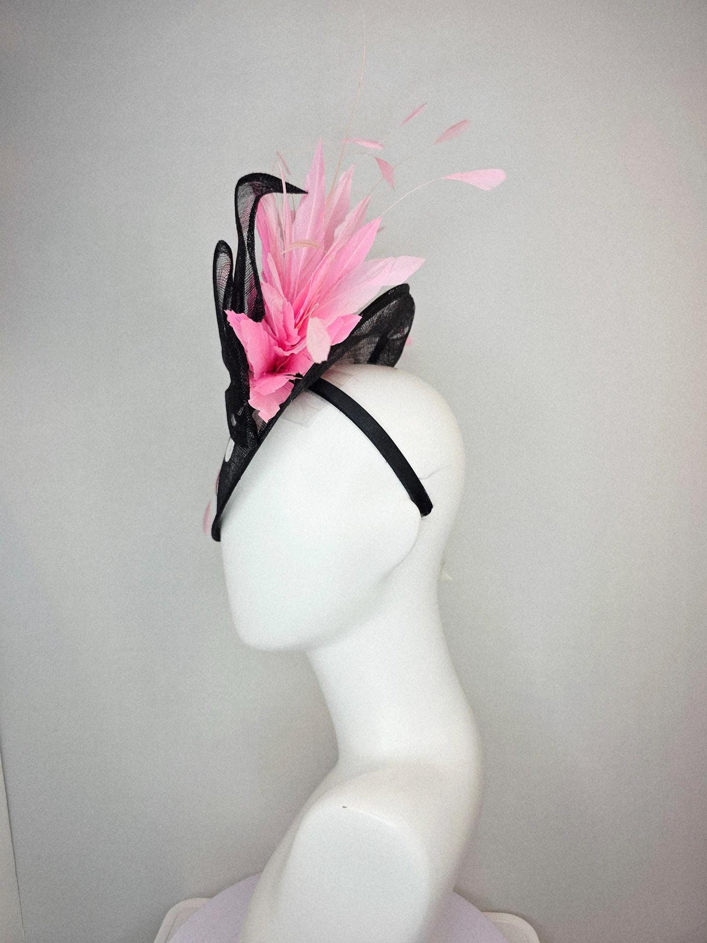 kentucky derby hat fascinator black and white polka dot sinamay saucer with black sinamay bow and light baby pink branching feathers