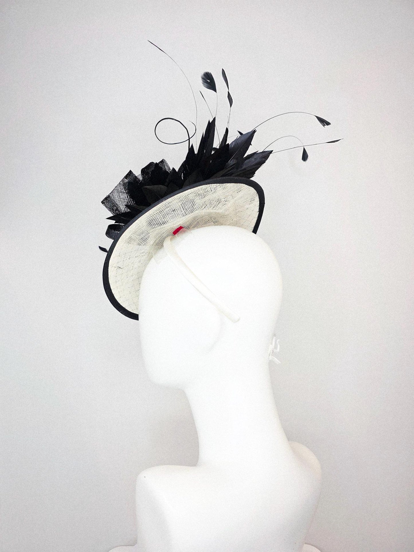kentucky derby hat fascinator ivory white sinamay saucer with black netting and black sinamay trim and bow and black branching feathers