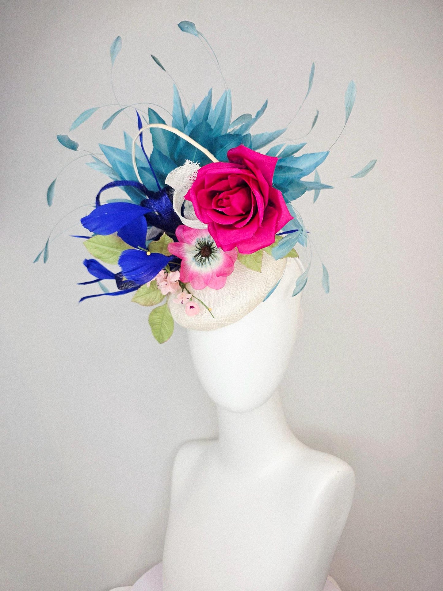 kentucky derby hat fascinator white sinamay with curls fuchsia satin rose and pink flowers light green leaves and cobalt teal blue feathers