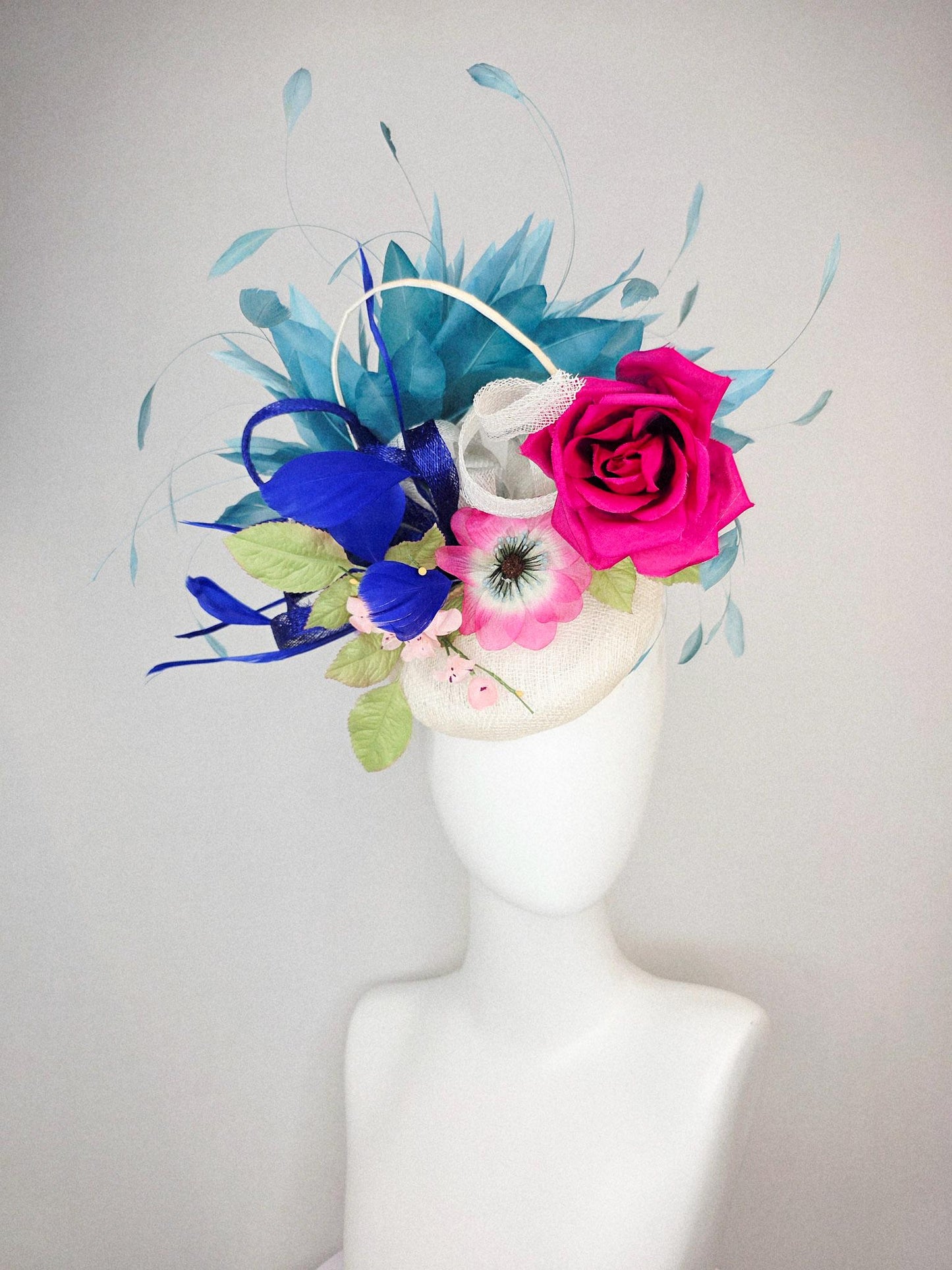 kentucky derby hat fascinator white sinamay with curls fuchsia satin rose and pink flowers light green leaves and cobalt teal blue feathers