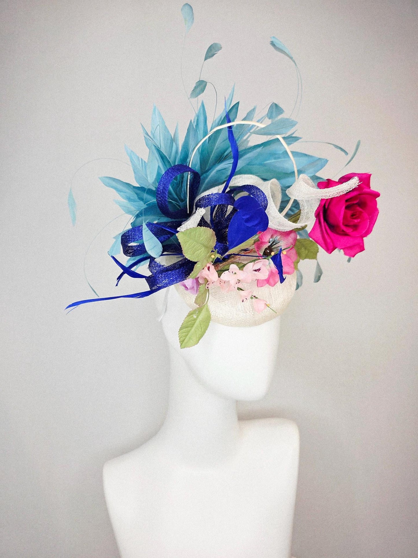 kentucky derby hat fascinator white sinamay with curls fuchsia satin rose and pink flowers light green leaves and cobalt teal blue feathers
