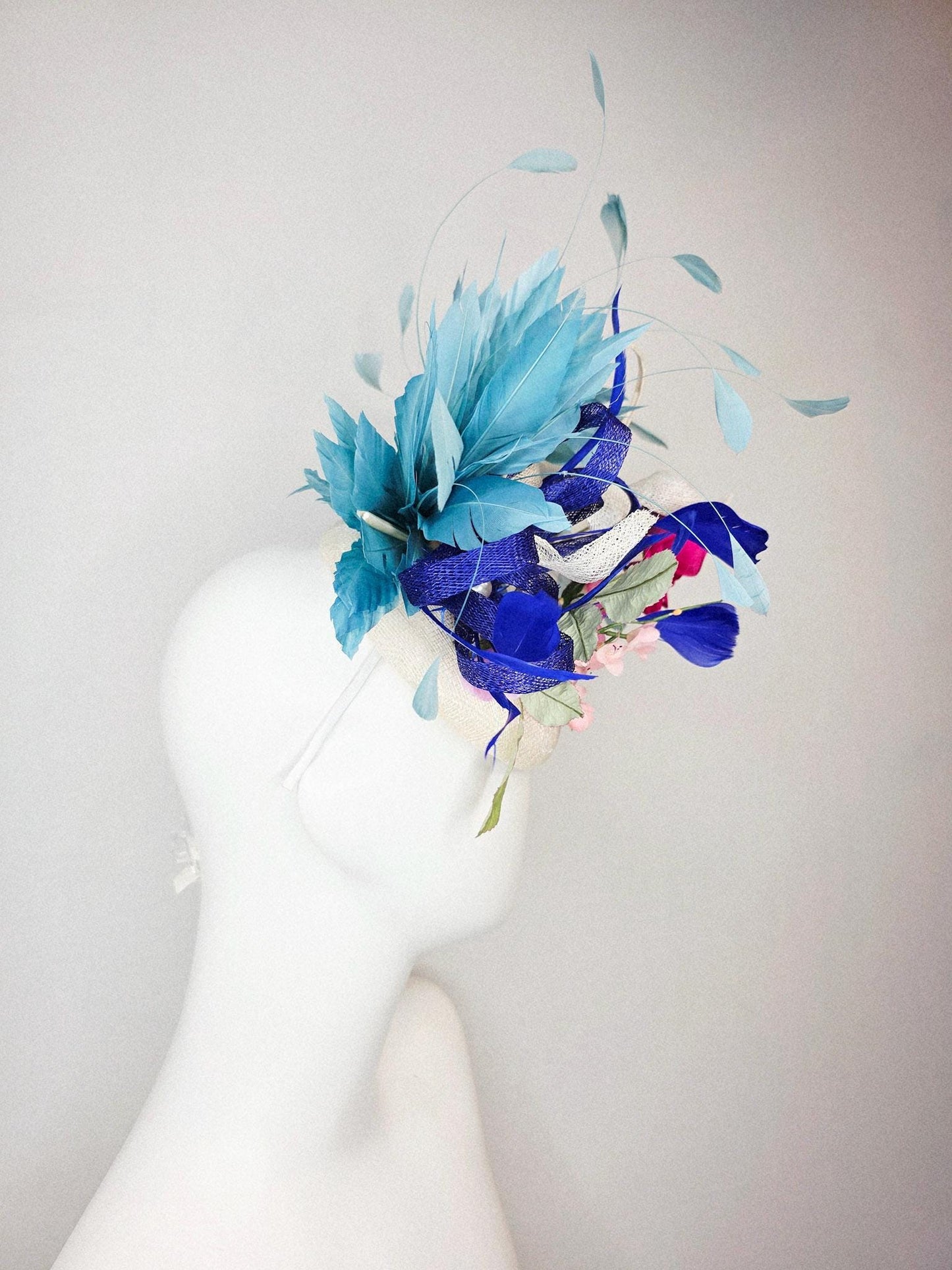 kentucky derby hat fascinator white sinamay with curls fuchsia satin rose and pink flowers light green leaves and cobalt teal blue feathers