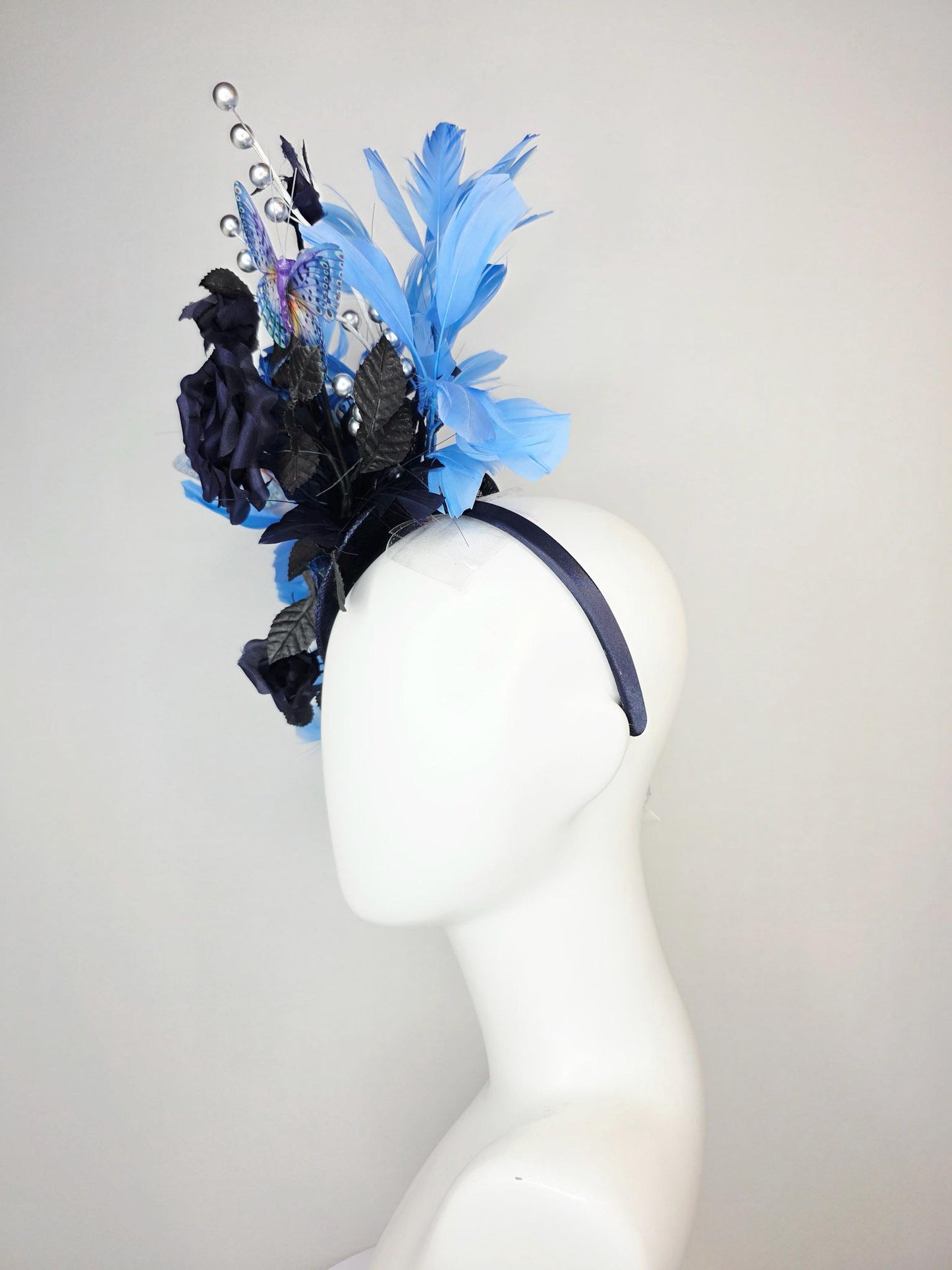 kentucky derby hat fascinator navy blue satin roses black leaves royal blue sky blue feathers silver pearls lavender purple blue butterflies
