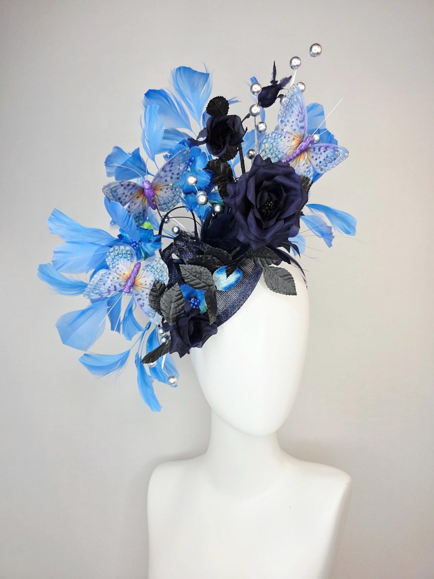 kentucky derby hat fascinator navy blue satin roses black leaves royal blue sky blue feathers silver pearls lavender purple blue butterflies