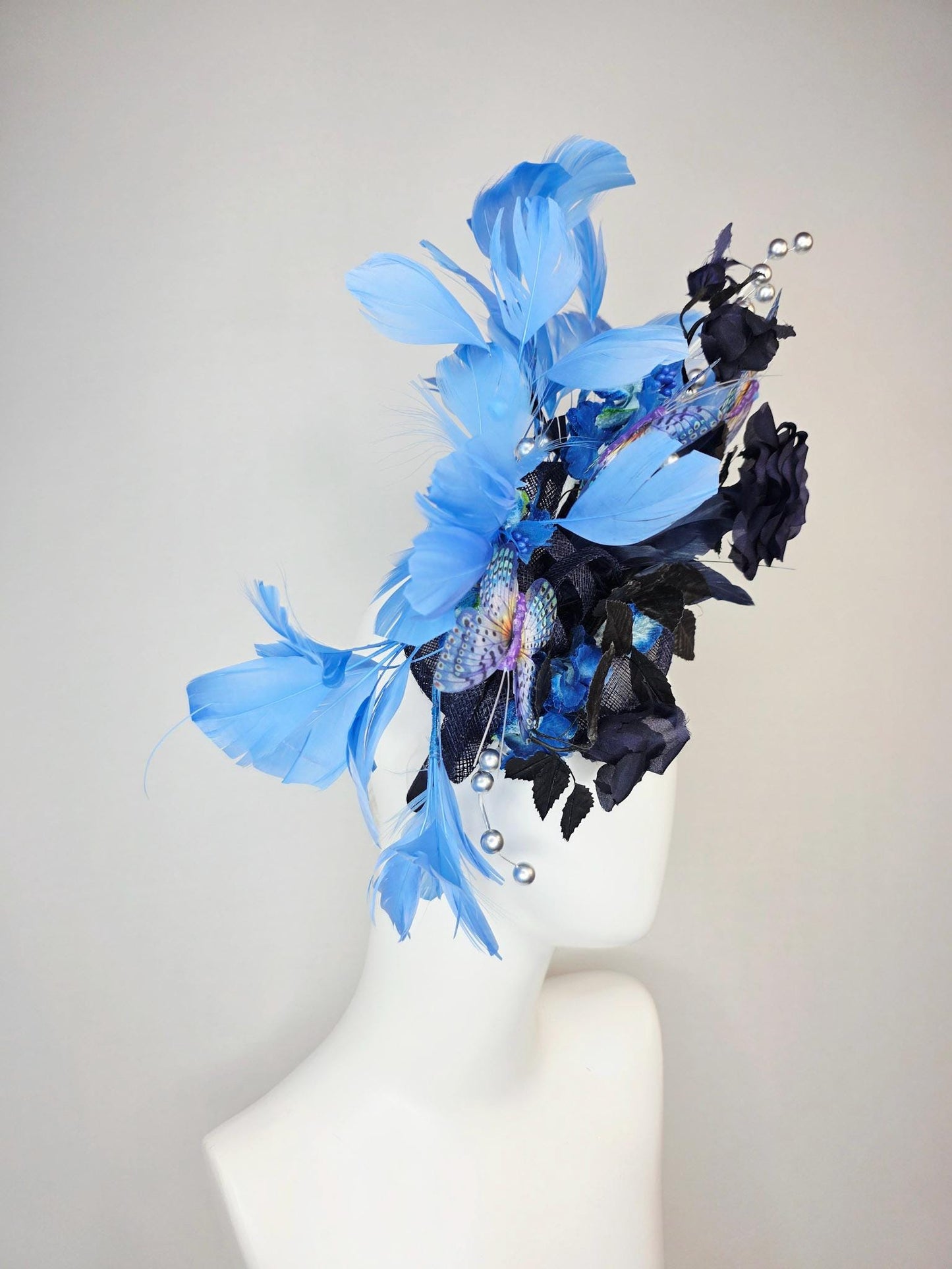 kentucky derby hat fascinator navy blue satin roses black leaves royal blue sky blue feathers silver pearls lavender purple blue butterflies