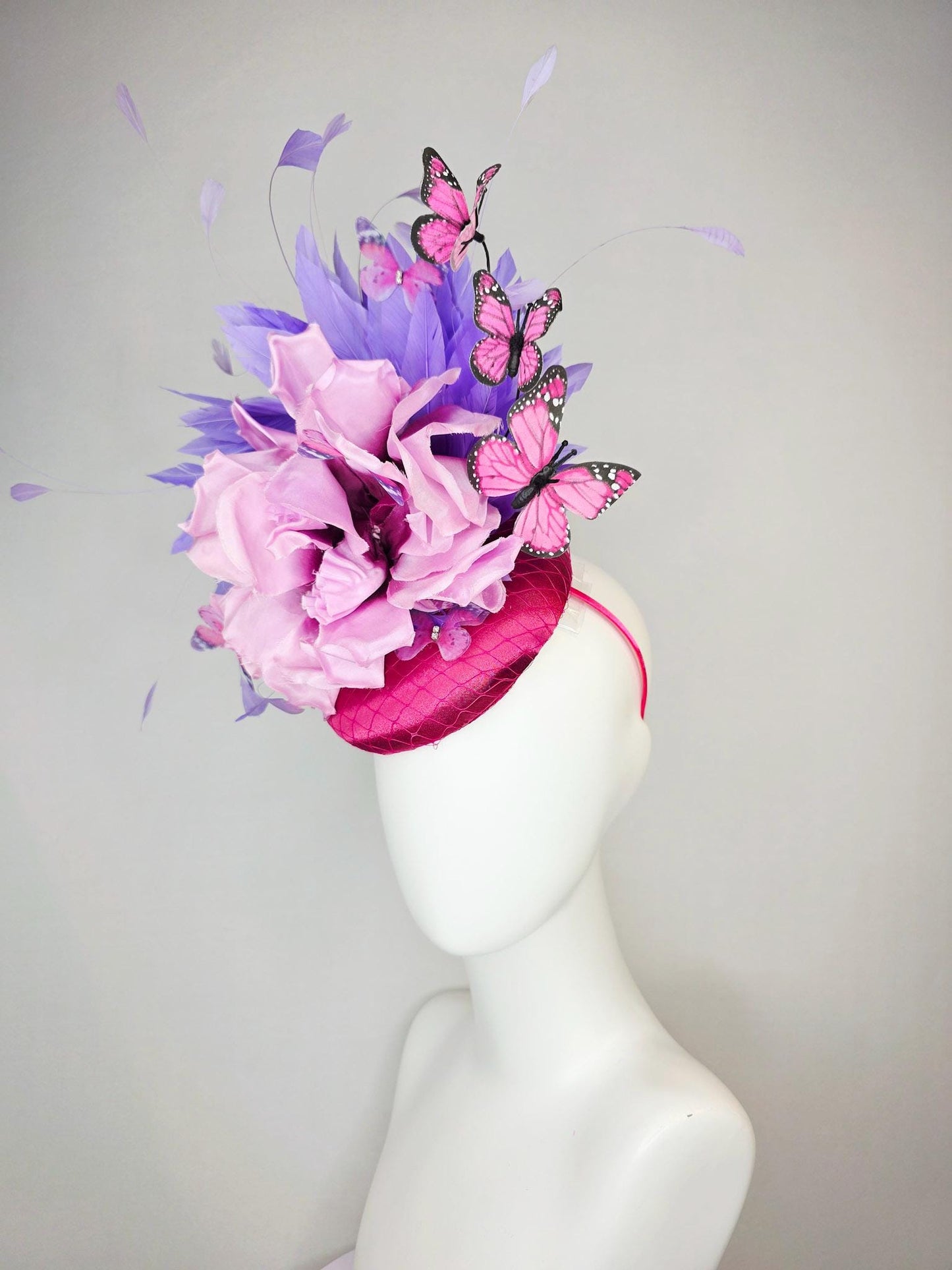 kentucky derby hat fascinator pink satin with netting large lilac purple satin flower lavender purple feathers and pink butterflies