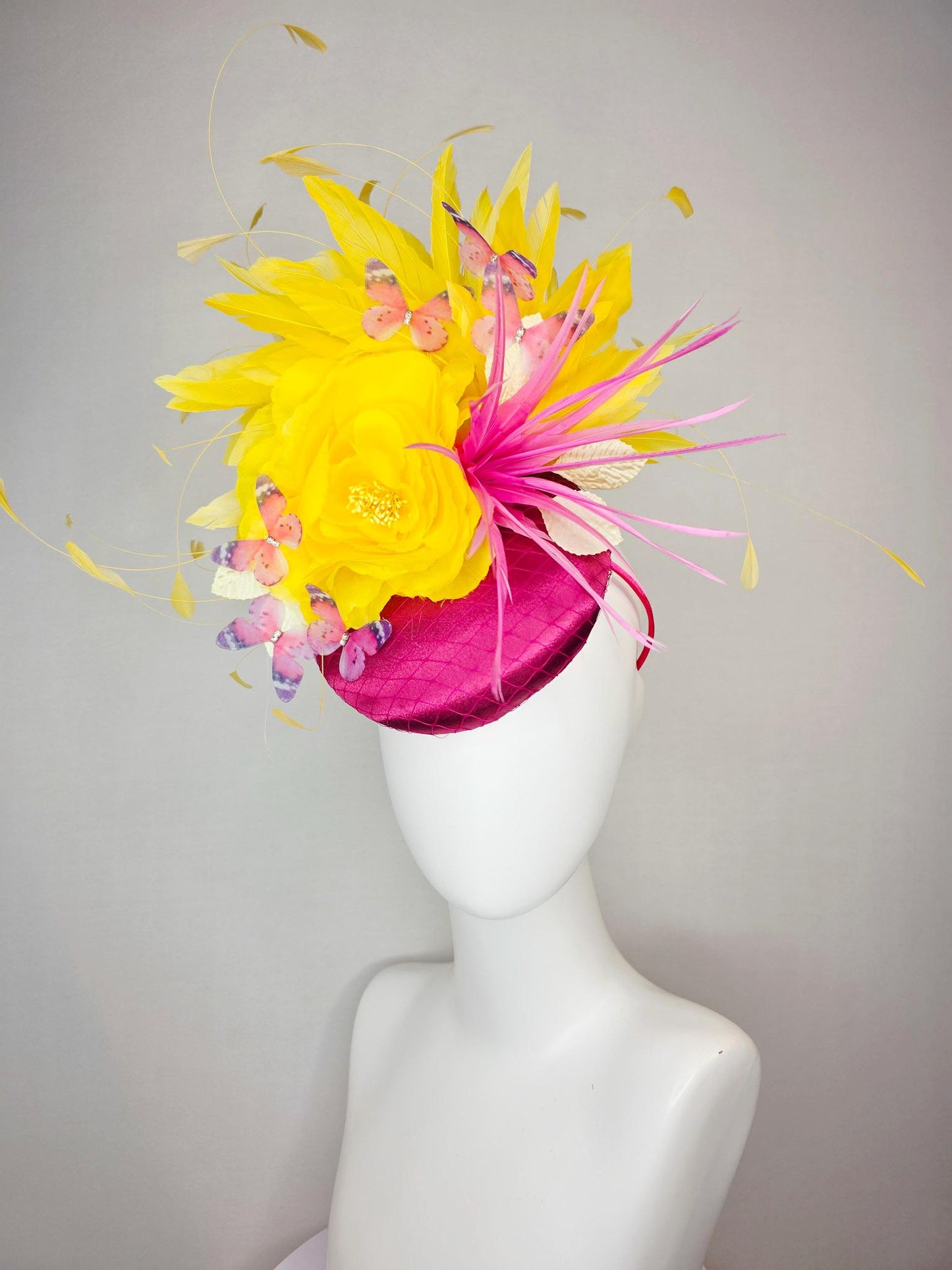 kentucky derby hat fascinator hot pink satin with netting yellow satin rose white leaves pink feather flower yellow feathers and butterflies