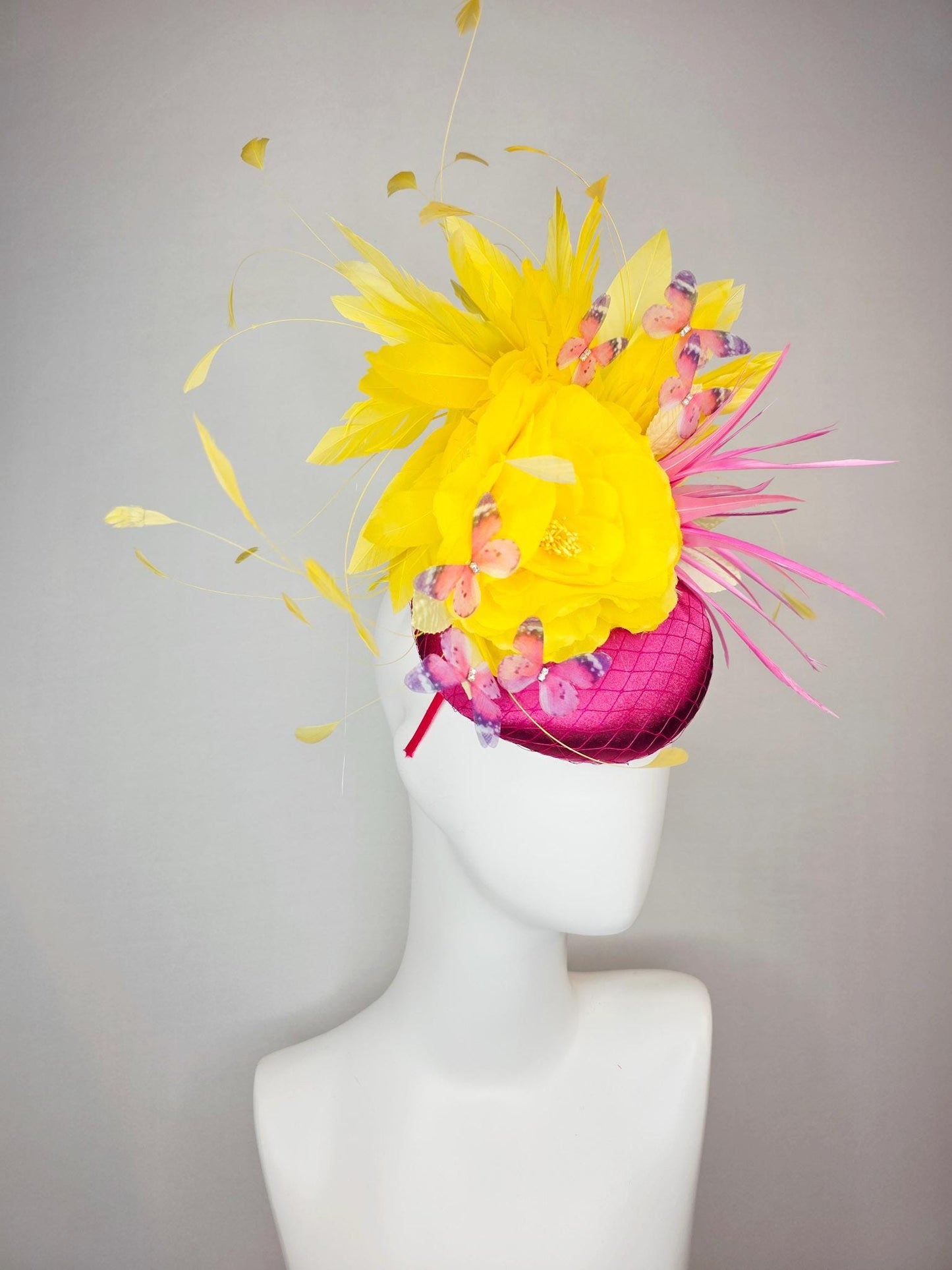 kentucky derby hat fascinator hot pink satin with netting yellow satin rose white leaves pink feather flower yellow feathers and butterflies