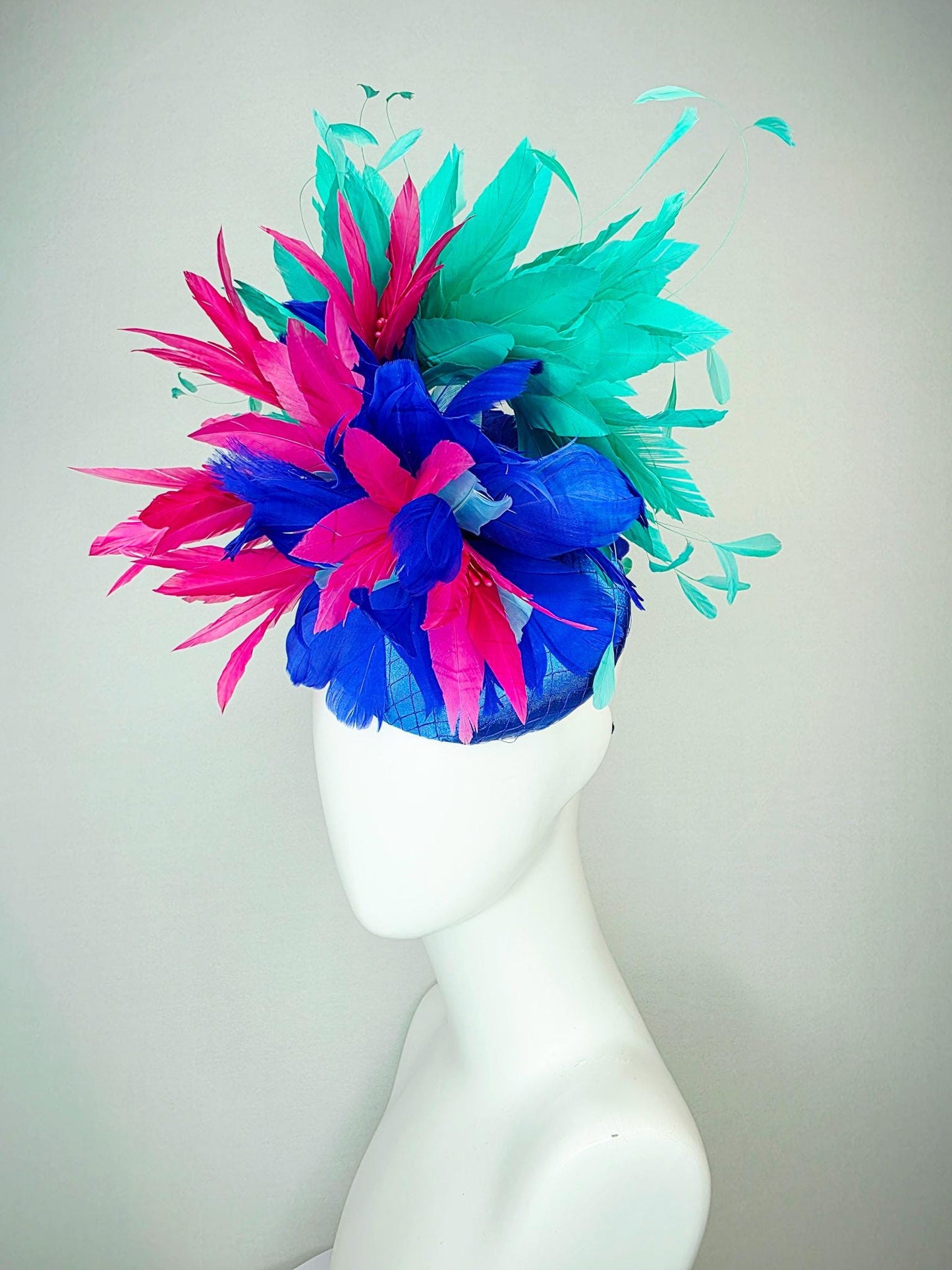 kentucky derby hat fascinator cobalt royal blue satin with netting pink feather flowers cobalt blue and mint aqua green branching feathers