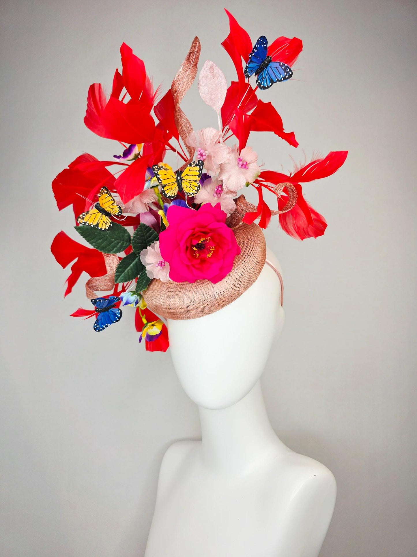 kentucky derby hat fascinator champagne pink sinamay fuchsia satin rose light pink flowers green leaves red feathers blue yellow butterflies