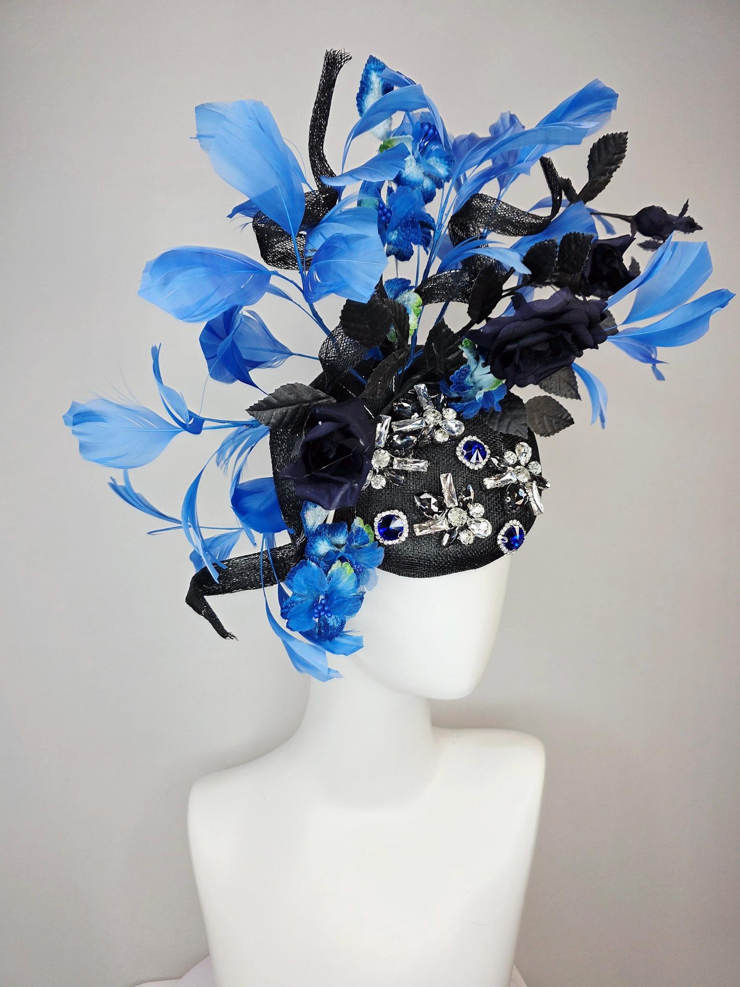 kentucky derby hat fascinator black sinamay with curls blue and clear crystal jewels navy blue satin roses black leaves royal blue feathers