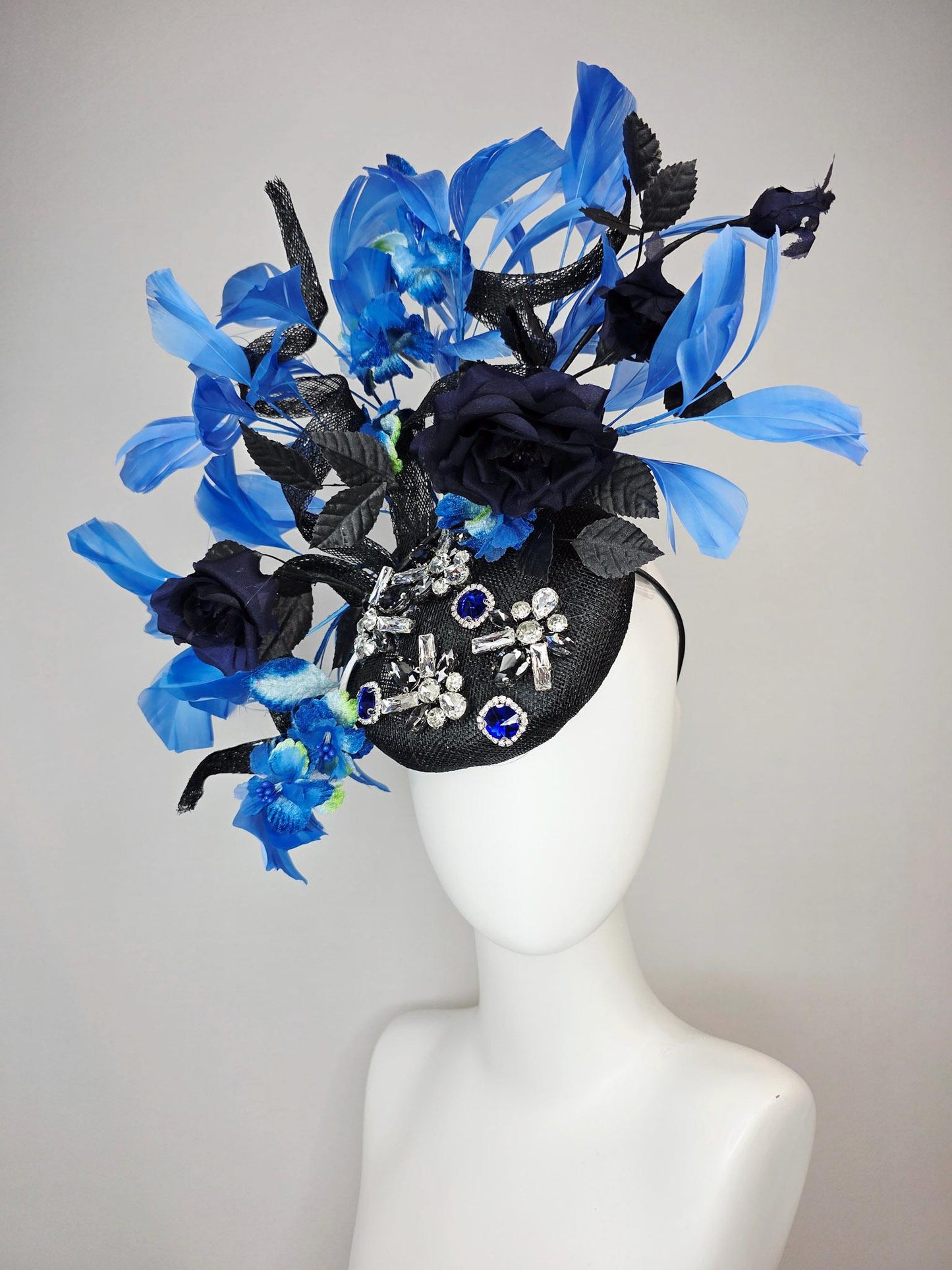 kentucky derby hat fascinator black sinamay with curls blue and clear crystal jewels navy blue satin roses black leaves royal blue feathers