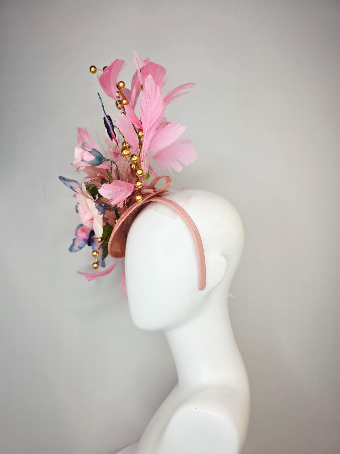 kentucky derby hat fascinator light pink satin rose green leaves dusty rose and baby blush pink feathers gold pearls pink blue butterflies