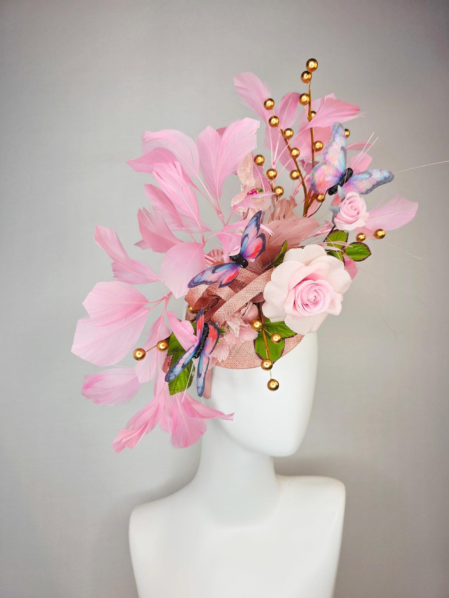 kentucky derby hat fascinator light pink satin rose green leaves dusty rose and baby blush pink feathers gold pearls pink blue butterflies