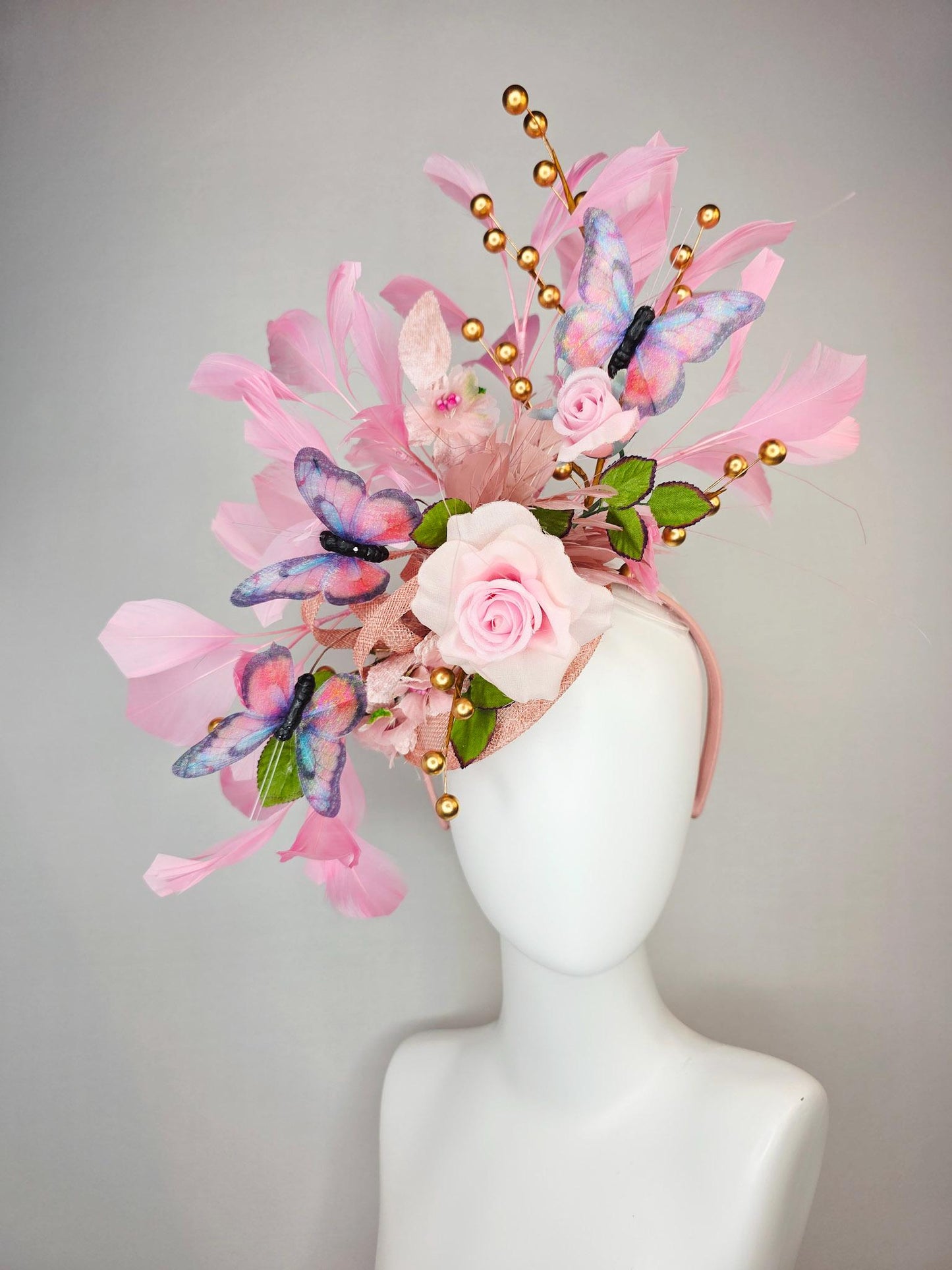 kentucky derby hat fascinator light pink satin rose green leaves dusty rose and baby blush pink feathers gold pearls pink blue butterflies
