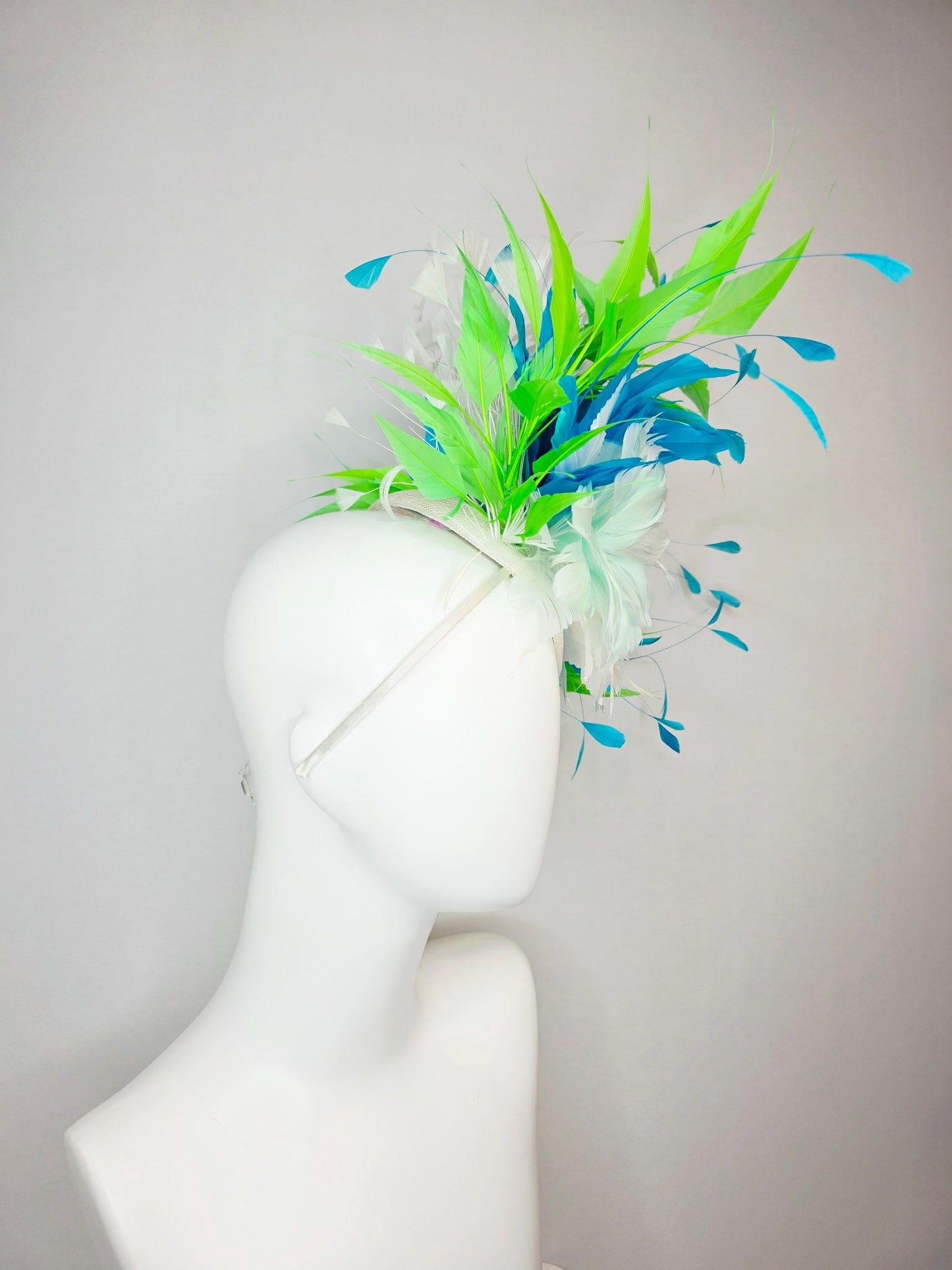 kentucky derby hat fascinator white light mint feather flower with turquoise blue lime green and white branching feathers