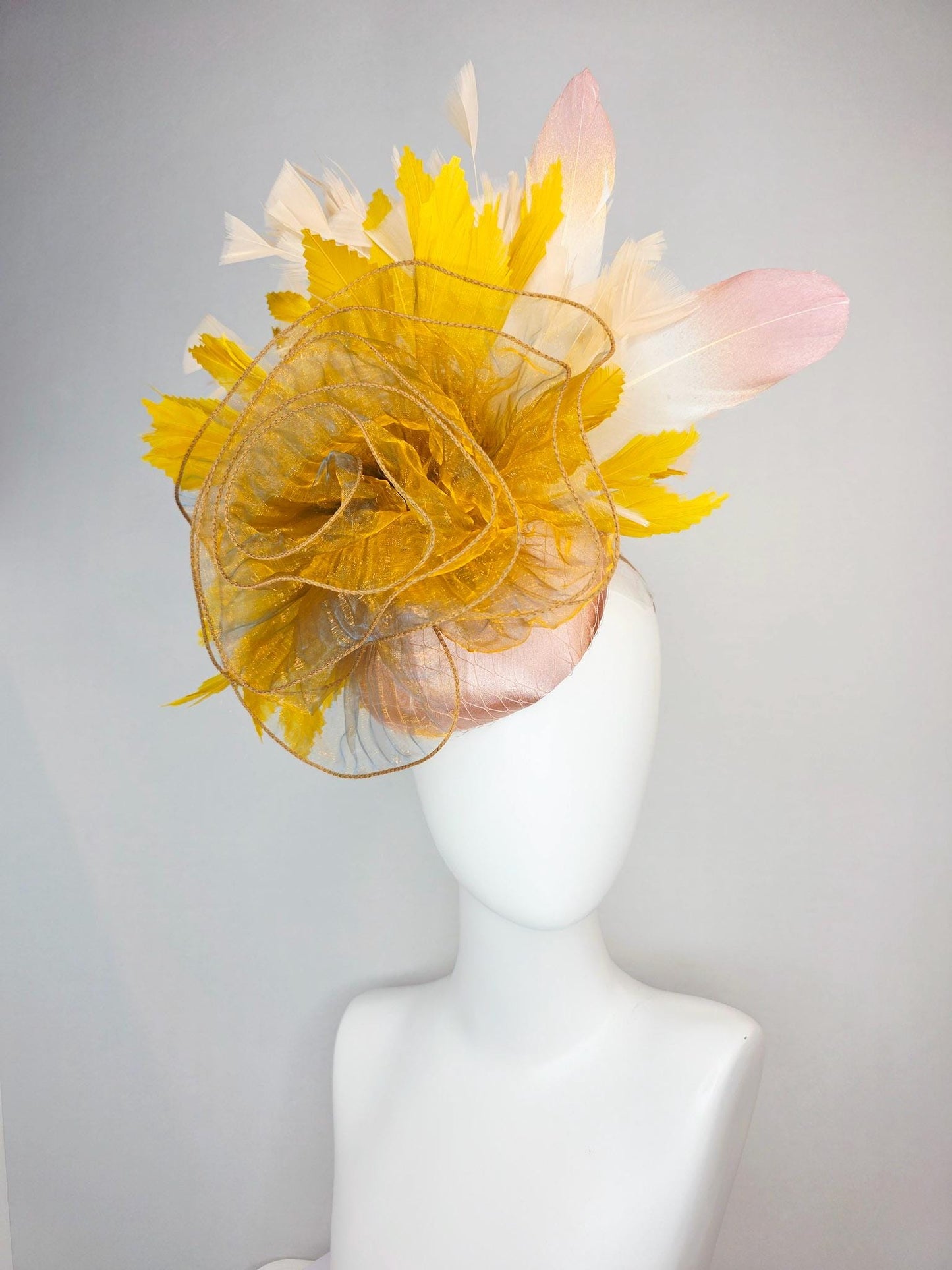 kentucky derby hat fascinator champagne pink satin with netting with large gold organza flower and mustard yellow cream beige feathers