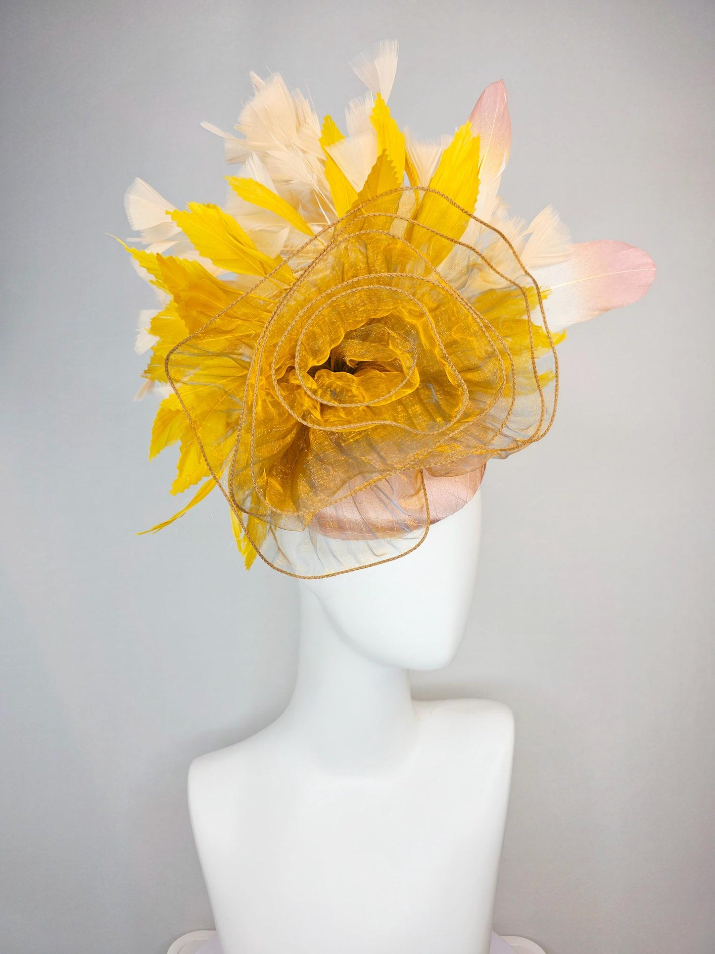kentucky derby hat fascinator champagne pink satin with netting with large gold organza flower and mustard yellow cream beige feathers