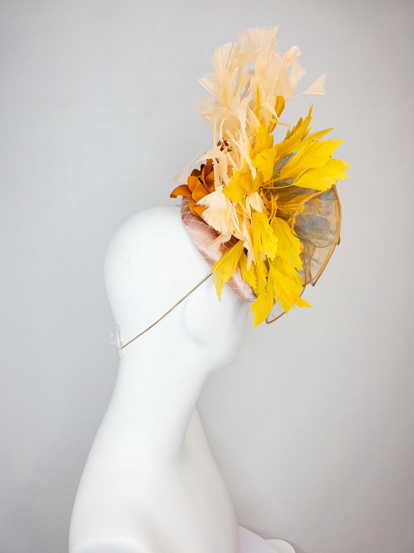 kentucky derby hat fascinator champagne pink satin with netting with large gold organza flower and mustard yellow cream beige feathers
