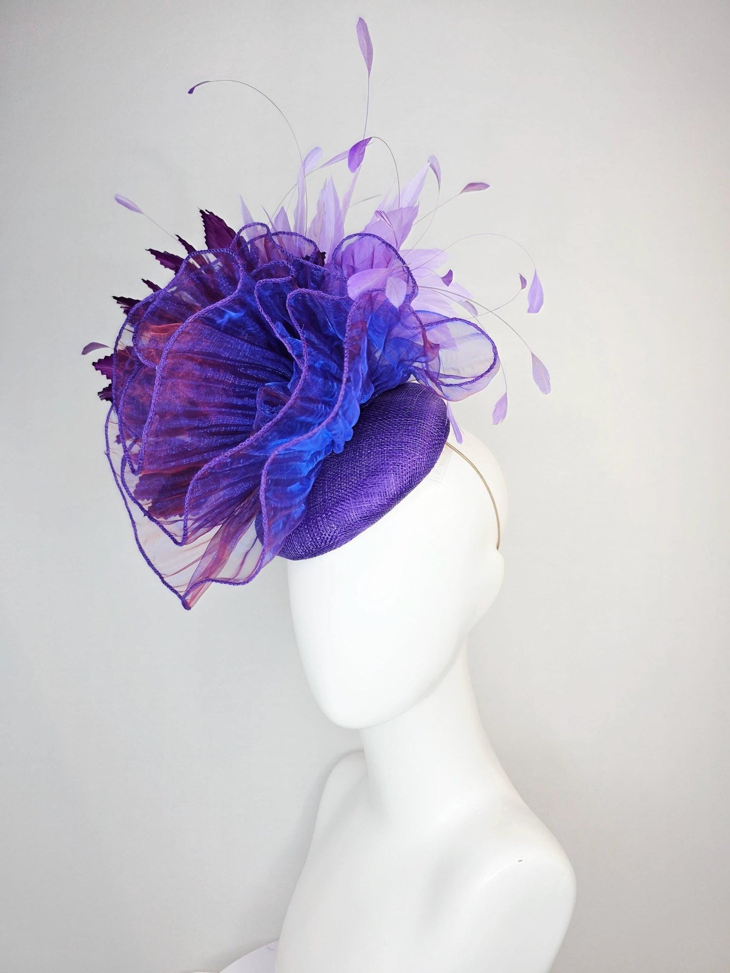 kentucky derby hat fascinator purple sinamay with large purple blue organza flower lavender and violet purple branching feathers