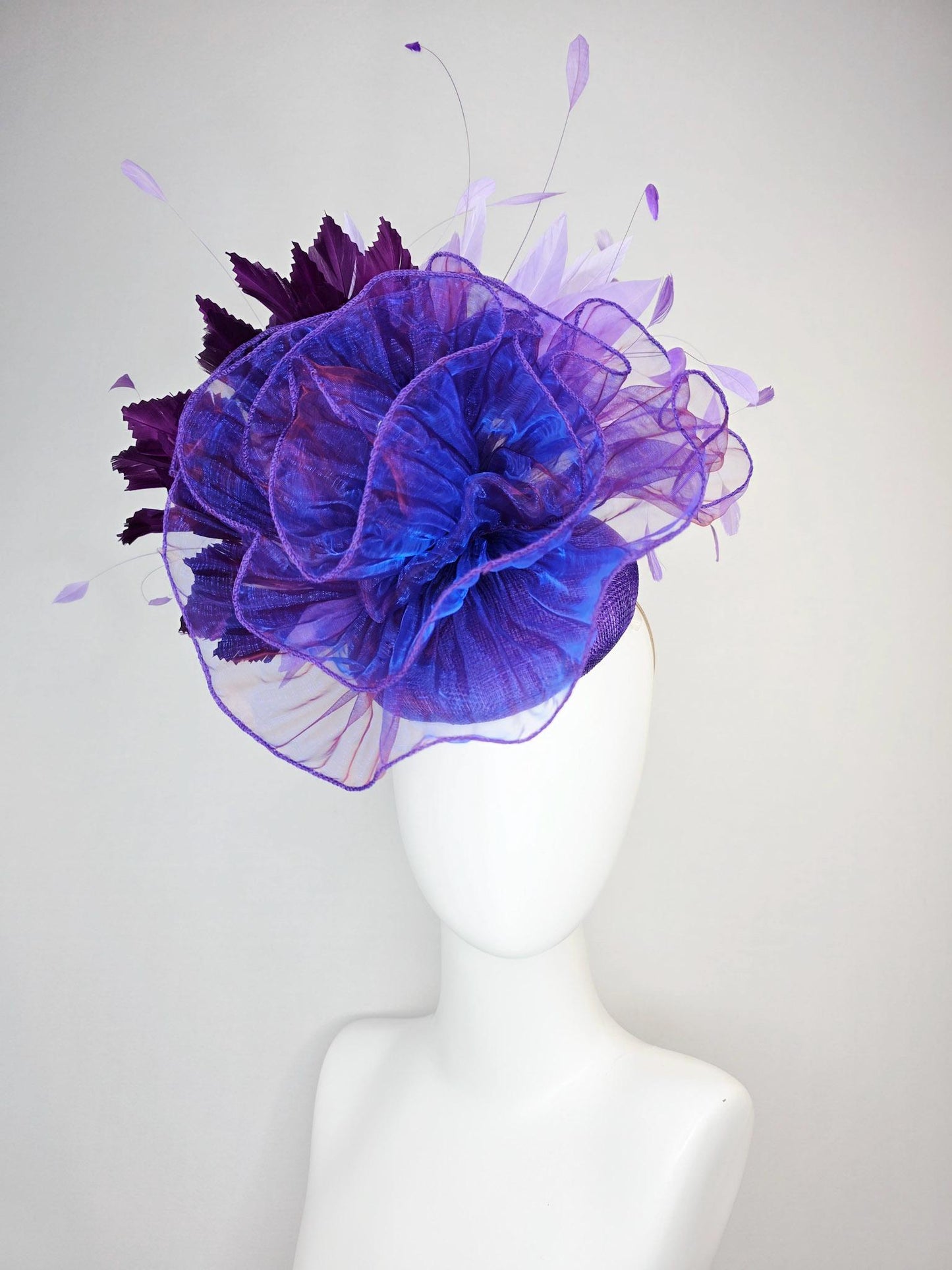 kentucky derby hat fascinator purple sinamay with large purple blue organza flower lavender and violet purple branching feathers