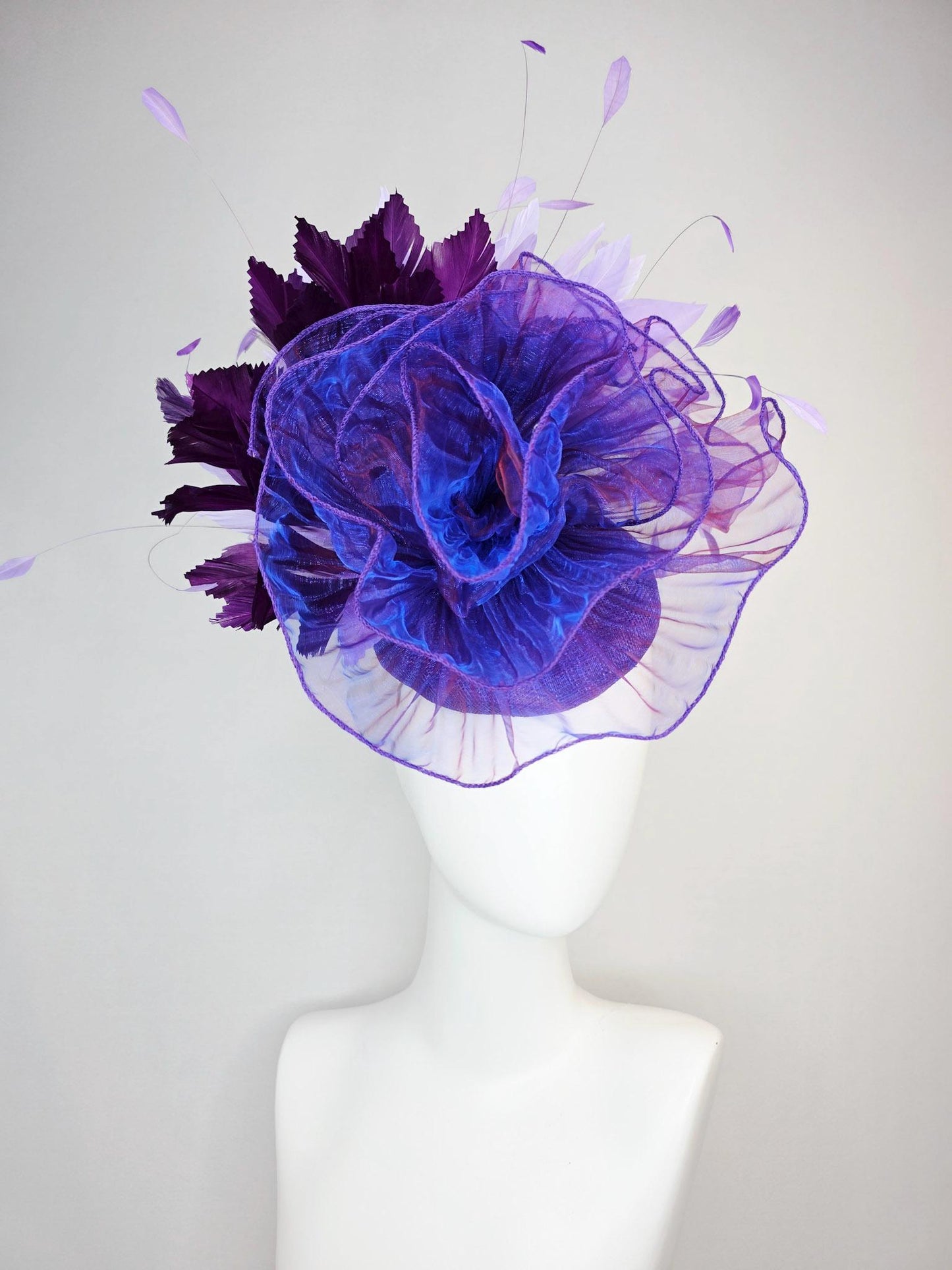 kentucky derby hat fascinator purple sinamay with large purple blue organza flower lavender and violet purple branching feathers