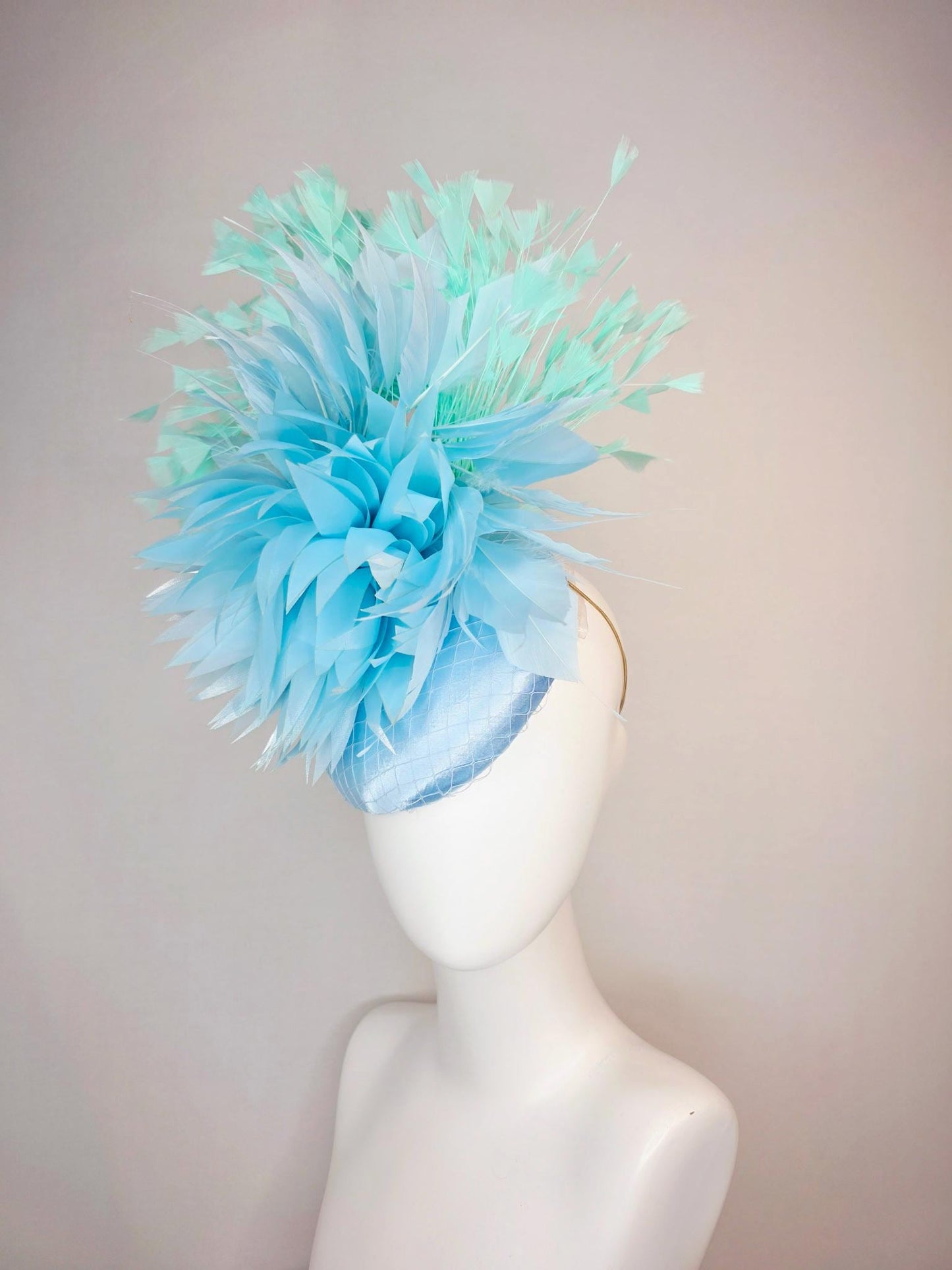 kentucky derby hat fascinator light baby blue satin with netting fluffy sky blue feathers and mint green branching feathers