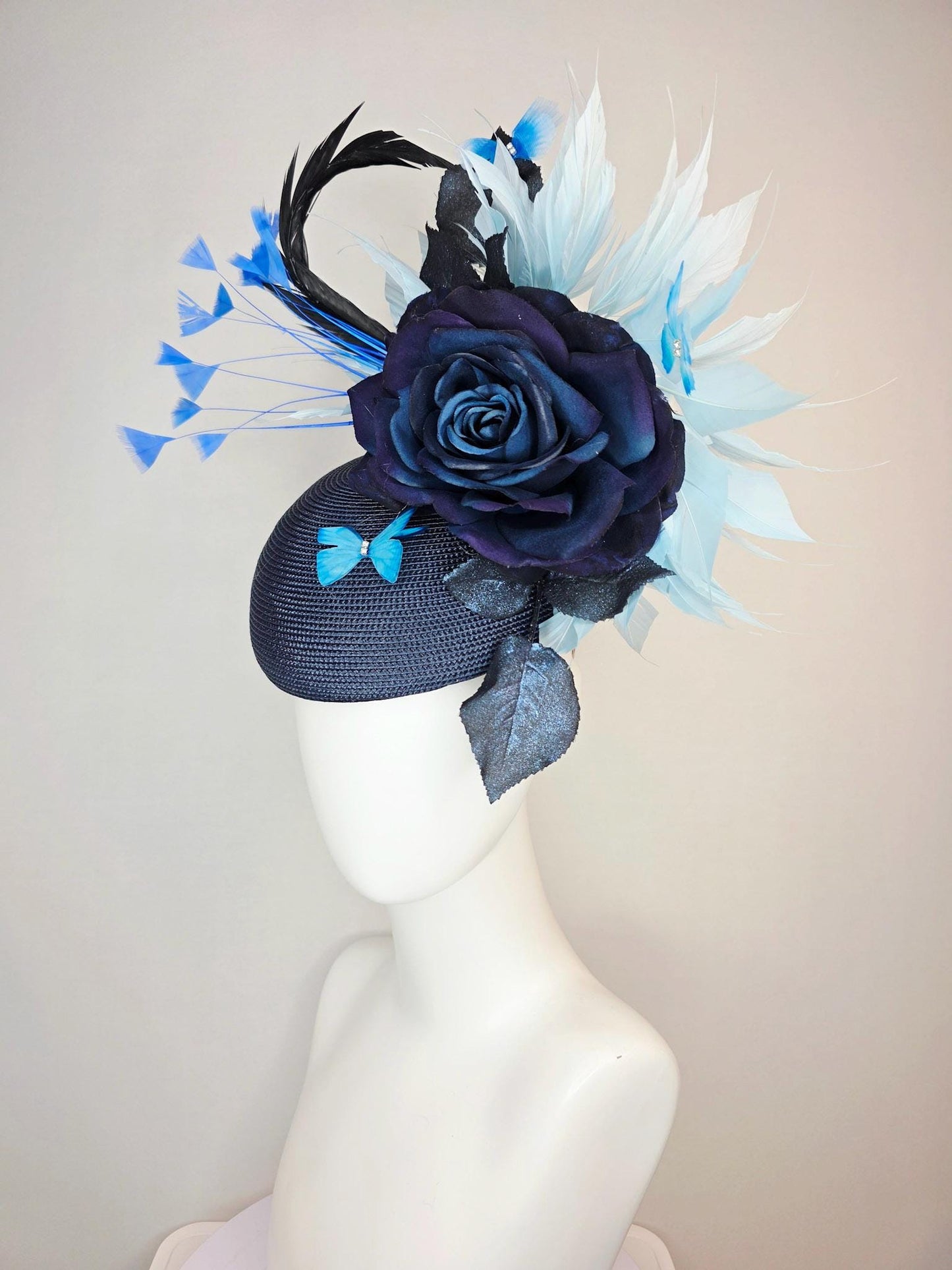 kentucky derby hat fascinator navy blue straw base large navy blue silk rose black leaves sky and baby blue feathers blue butterflies