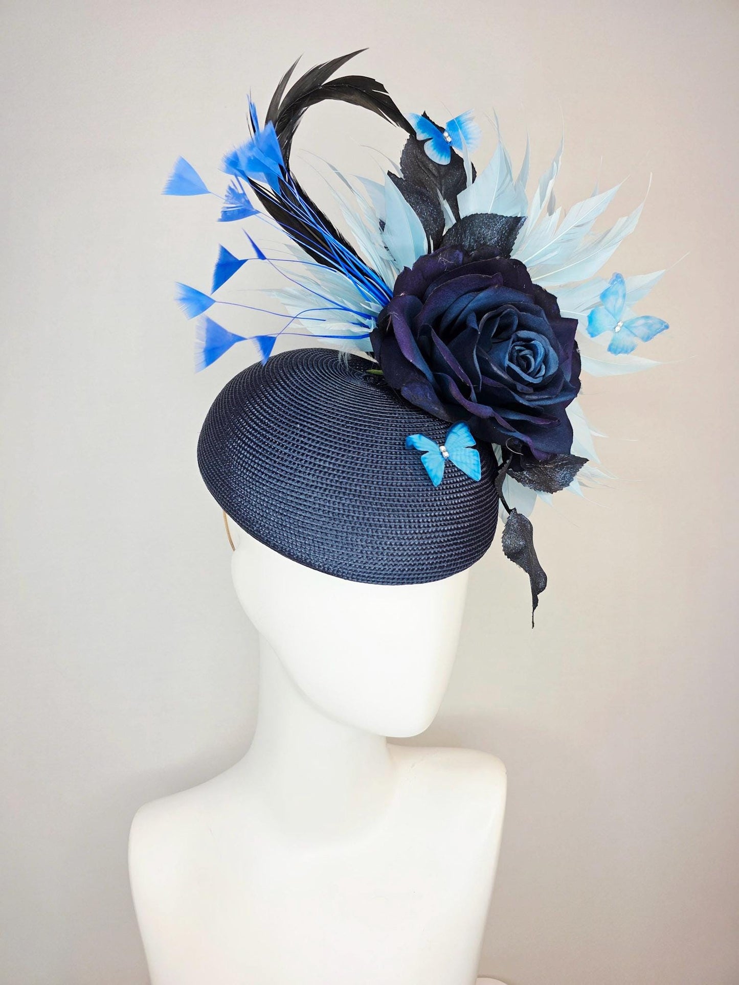 kentucky derby hat fascinator navy blue straw base large navy blue silk rose black leaves sky and baby blue feathers blue butterflies
