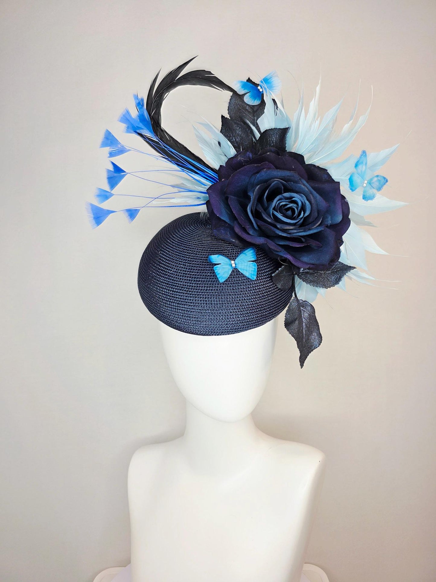 kentucky derby hat fascinator navy blue straw base large navy blue silk rose black leaves sky and baby blue feathers blue butterflies